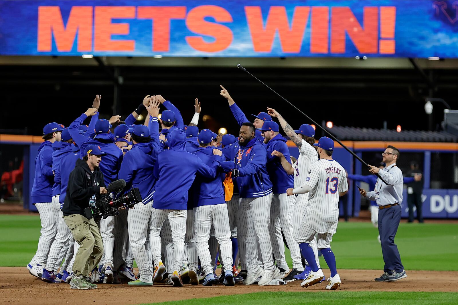 The New York Mets celebrate after defeating the Philadelphia Phillies in Game 4 of the National League baseball playoff series, Wednesday, Oct. 9, 2024, in New York. (AP Photo/Adam Hunger)