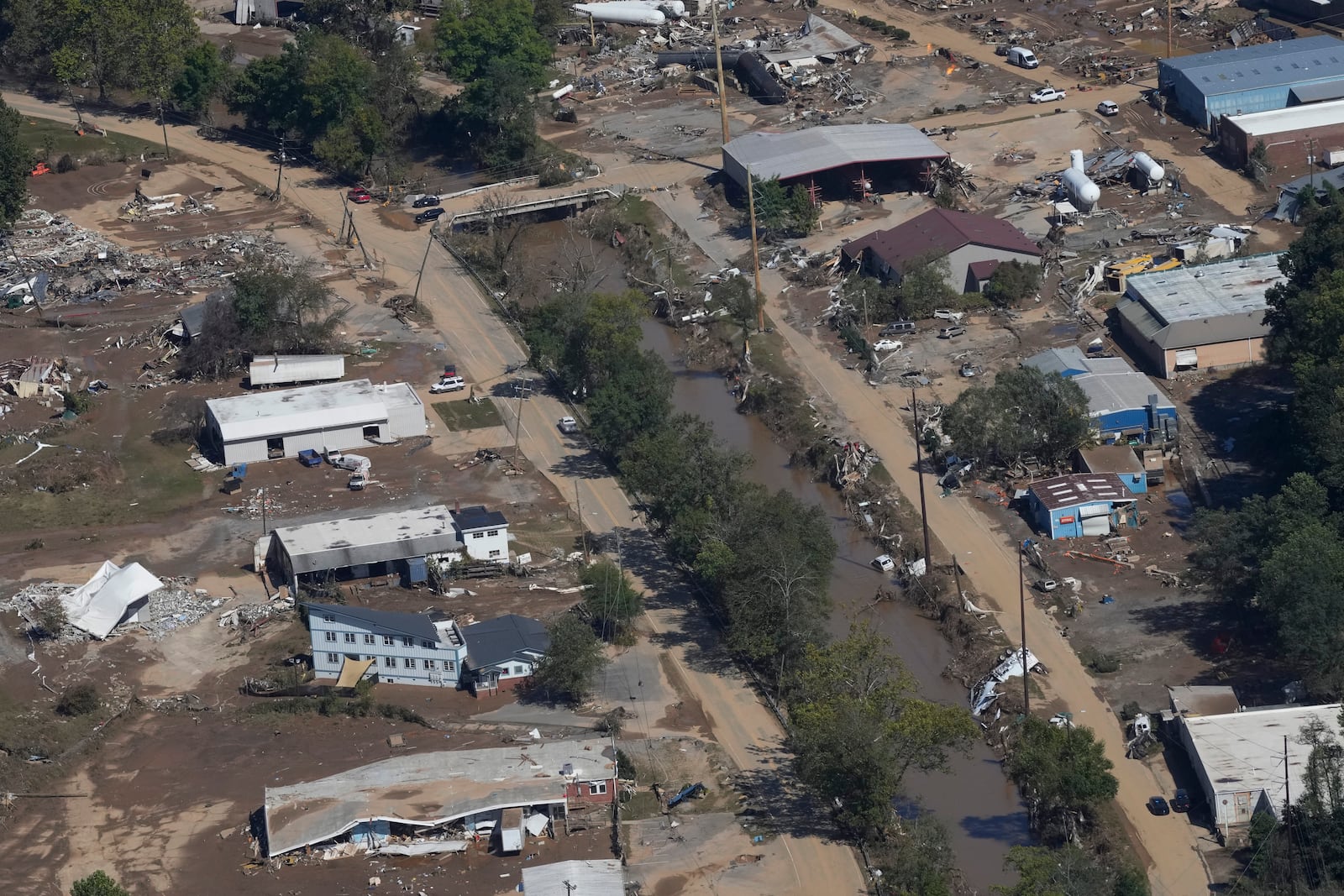 FILE - A view of damage in Asheville, N.C., is seen during an aerial tour with President Joe Biden who looked at areas impacted by Hurricane Helene near Asheville, N.C., Oct. 2, 2024. (AP Photo/Susan Walsh, File)