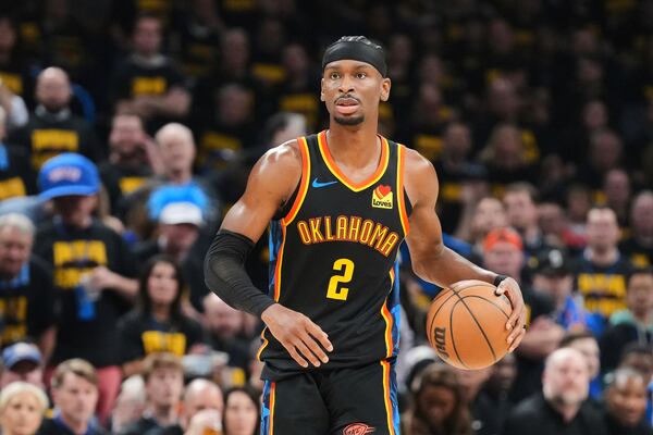 Oklahoma City Thunder guard Shai Gilgeous-Alexander (2) handles the ball as he works against the Denver Nuggets in the second half of Game 2 in the conference semifinals of the NBA basketball playoffs, Wednesday, May 7, 2025, in Oklahoma City. (AP Photo/Kyle Phillips)