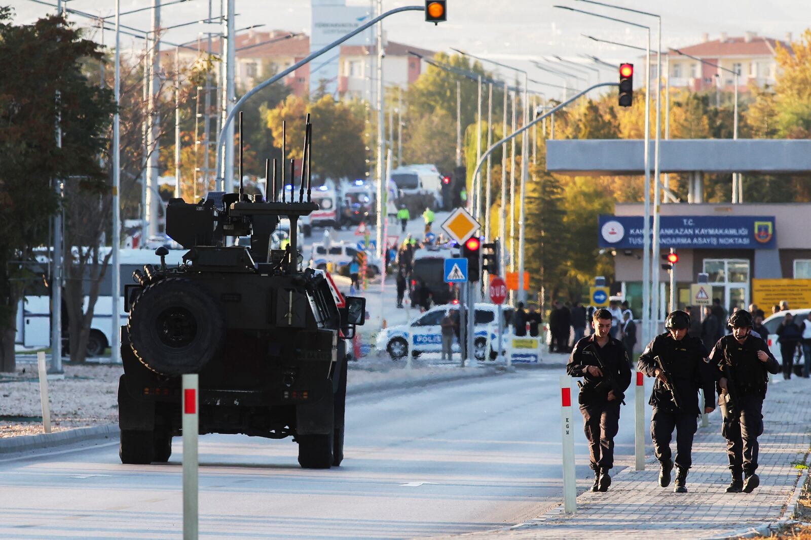 Emergency and security teams are deployed outside the Turkish state-run aerospace and defense company Turkish Aerospace Industries Inc. on the outskirts of Ankara, Turkey, Wednesday, Oct. 23, 2024. (Yavuz Ozden/Dia Photo via AP)