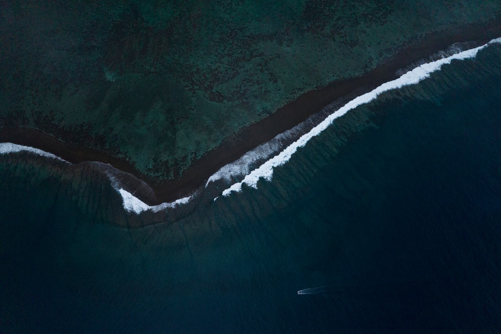 FILE - A wave at Teahupo'o crashes onto the coral reef in Tahiti, French Polynesia, Jan. 11, 2024. (AP Photo/Daniel Cole, File)