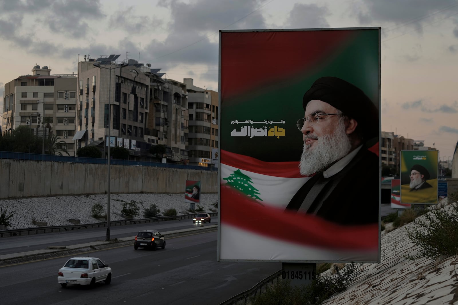 Billboards with a picture of the late Lebanon's Hezbollah leader Sayyed Hassan Nasrallah are displayed on a Beirut airport highway, Saturday, Oct. 5, 2024. (AP Photo/Bilal Hussein)