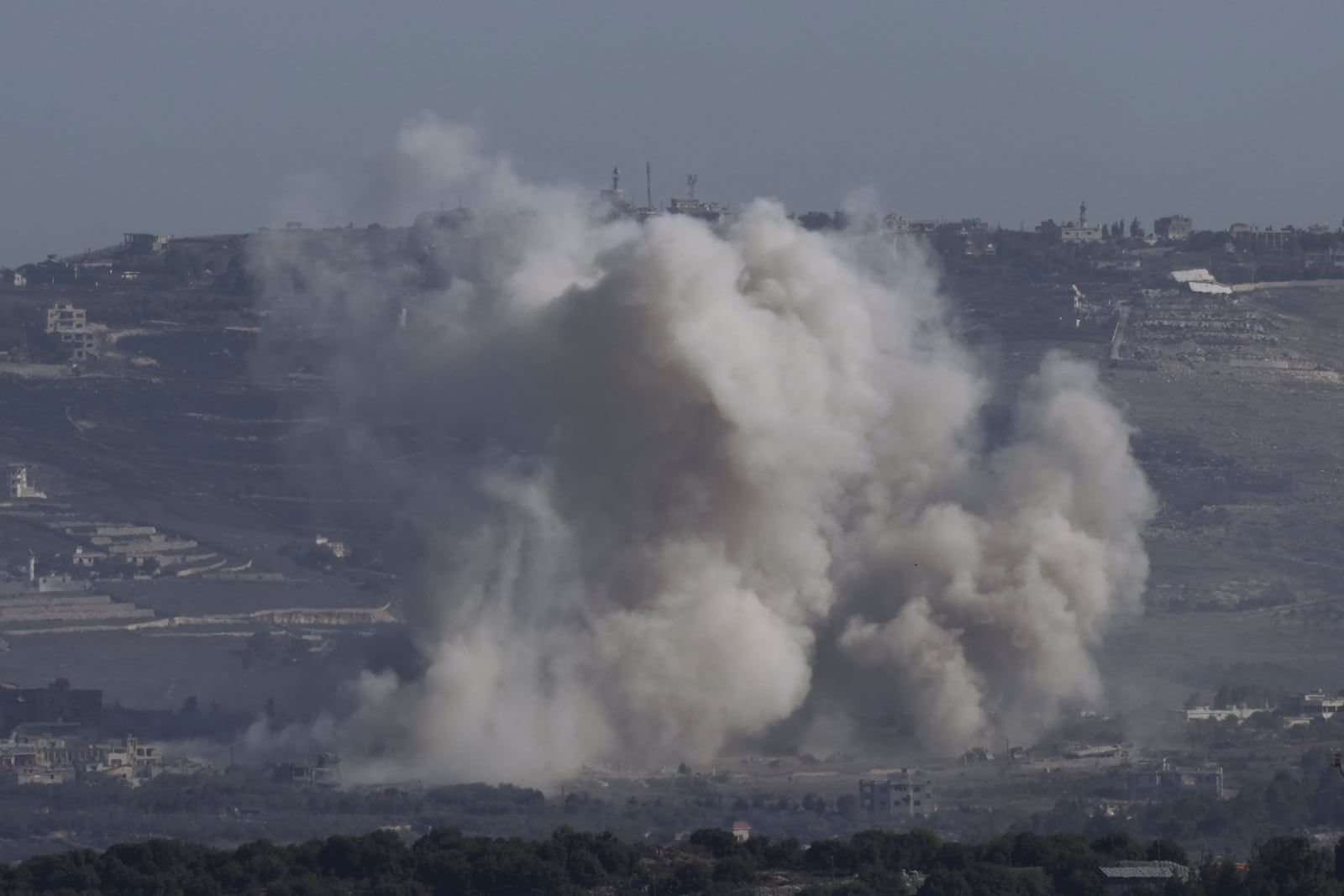 Smoke rises following an Israeli bombardment in southern Lebanon as seen from northern Israel, Friday, Oct. 4, 2024. (AP Photo/Baz Ratner)