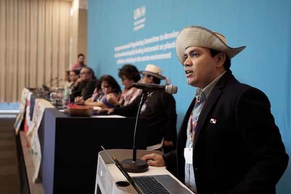 Juan Carlos Monterrey, right, head of Panama's delegation, speaks before a press conference of members of The International Indigenous Peoples' Forum on Plastics at the fifth session of the Intergovernmental Negotiating Committee on Plastic Pollution in Busan, South Korea, Saturday, Nov. 30, 2024. (AP Photo/Ahn Young-joon)