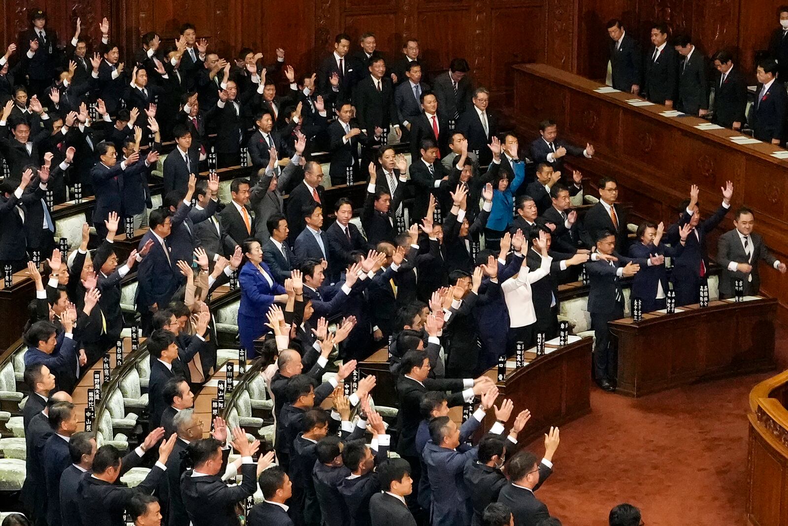 Lawmakers give three cheers after dissolving the lower house, the more powerful of the two parliamentary chambers, during an extraordinary Diet session at the lower house of parliament Wednesday, Oct. 9, 2024, in Tokyo. (AP Photo/Eugene Hoshiko)