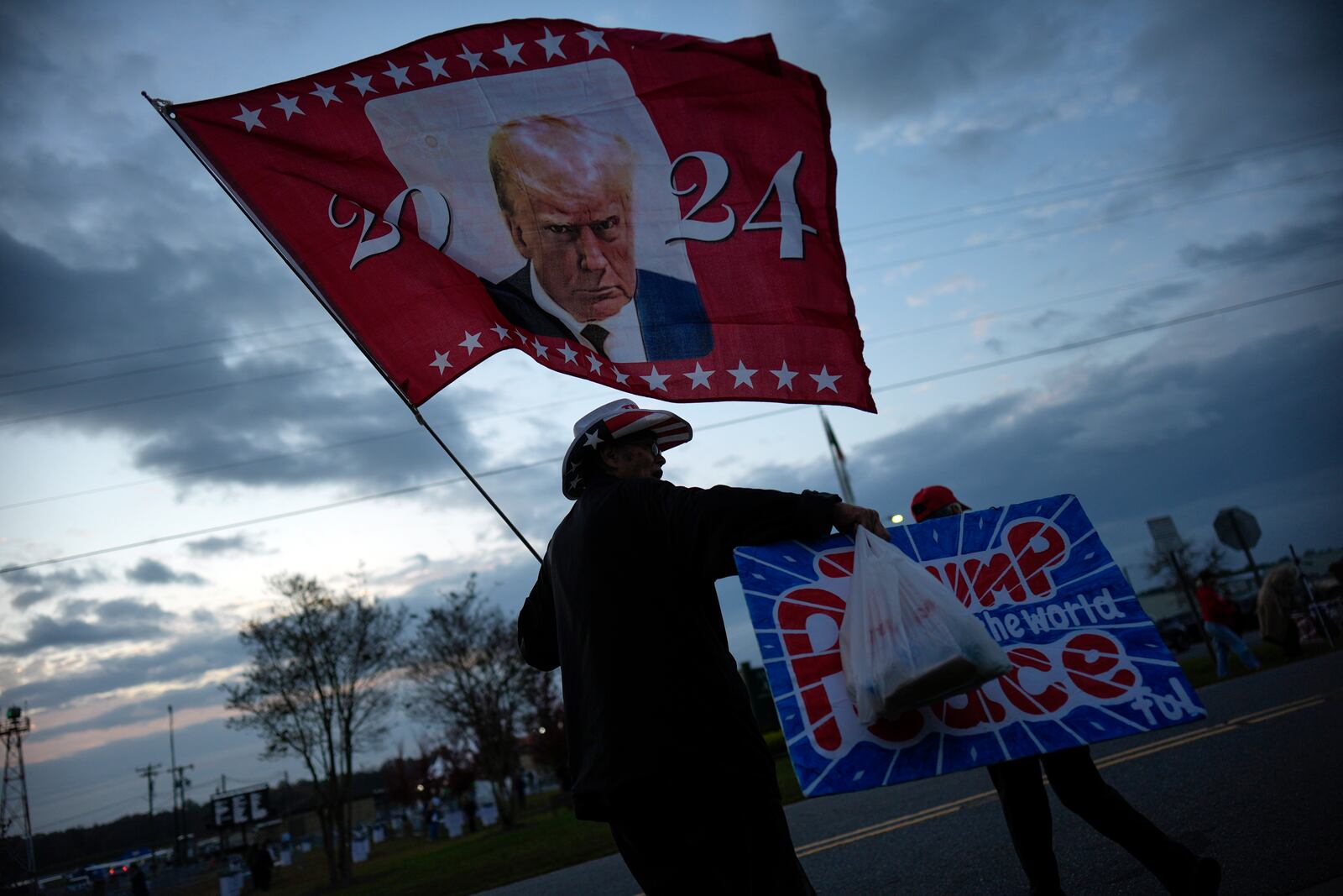 Supporters arrive before Republican presidential nominee former President Donald Trump speaks at a campaign rally in Gastonia, N.C., Saturday, Nov. 2, 2024. (AP Photo/Chris Carlson)