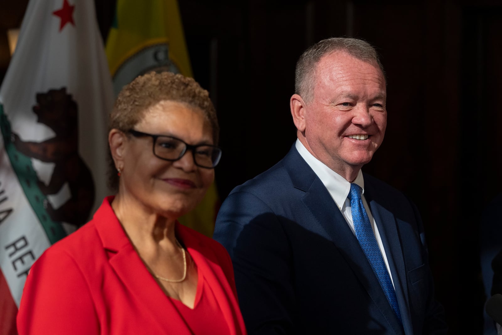 Los Angeles Mayor Karen Bass, left, and newly appointed police chief Jim McDonnell listen to questions from the media during a news conference in Los Angeles, Friday, Oct. 4, 2024. (AP Photo/Jae C. Hong)