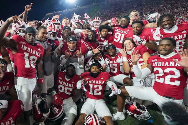 Indiana players celebrate after defeating Michigan in an NCAA college football game in Bloomington, Ind., Saturday, Nov. 9, 2024. (AP Photo/AJ Mast)