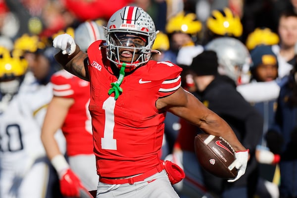 Ohio State running back Quinshon Judkins celebrates making a first down against Michigan during the first half of an NCAA college football game Saturday, Nov. 30, 2024, in Columbus, Ohio. (AP Photo/Jay LaPrete)