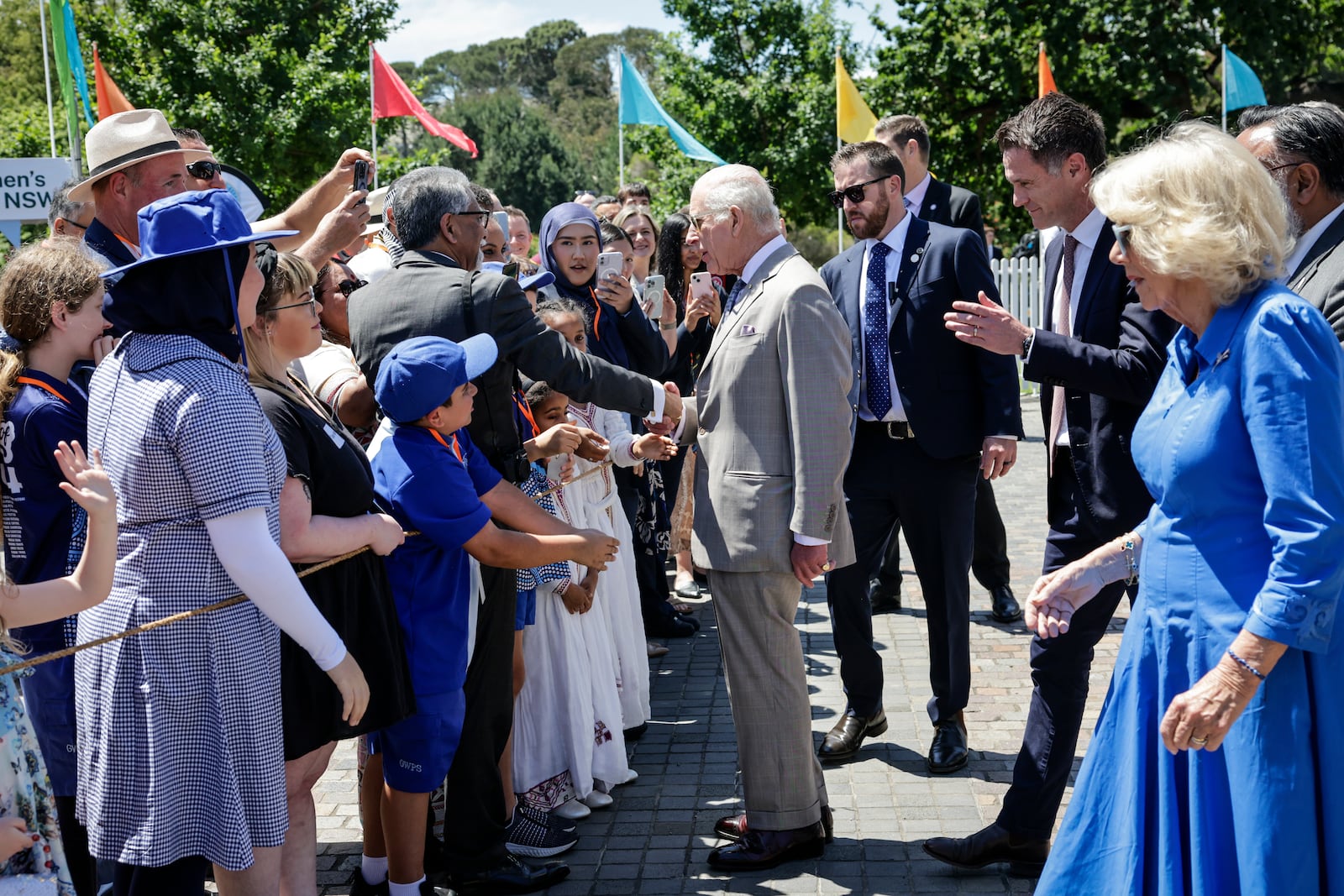 Britain's King Charles III and Queen Camilla meets the crowd as they attend the Premier's Community BBQ on Tuesday Oct. 22, 2024 in Sydney, Australia. (Brook Mitchell/Pool Photo via AP)