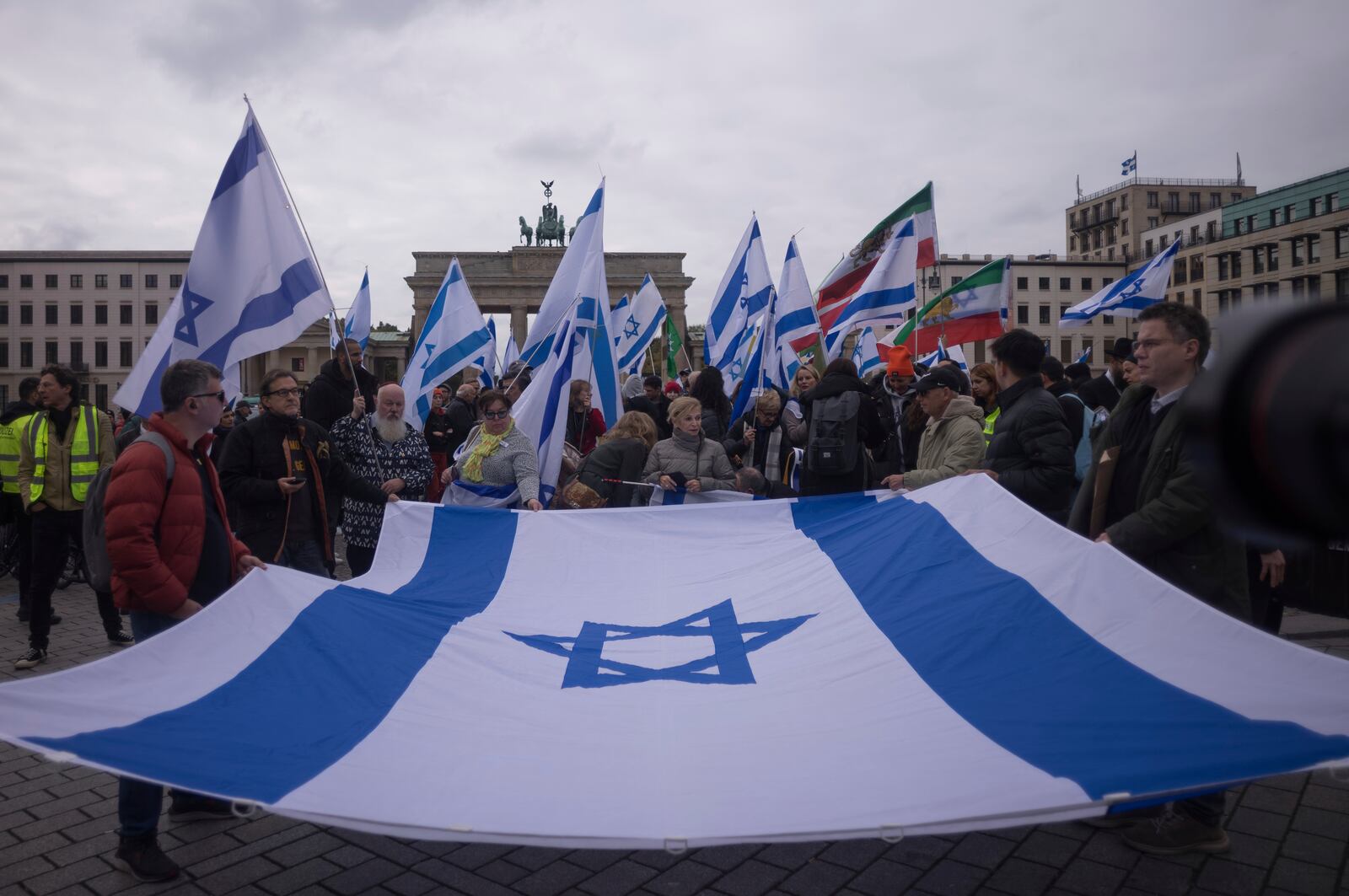 People attend a demonstration in support of Israel to mark the first anniversary of the Hamas attack on Israel, at the Brandenburg Gate in Berlin, Germany, Sunday, Oct. 6, 2024. (AP Photo/Markus Schreiber)