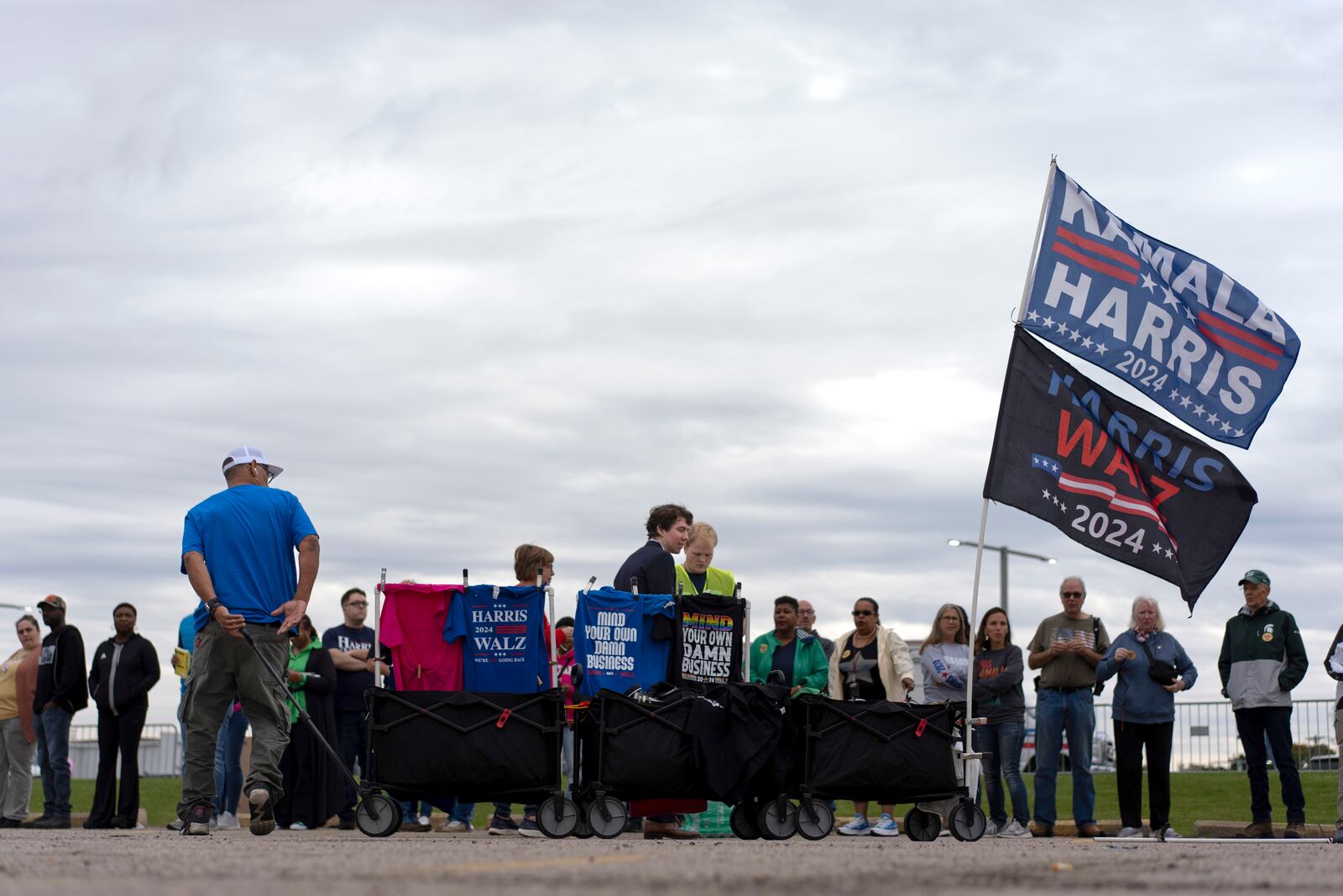 Campaign t-shirts and flags are for sale before a campaign rally for Democratic presidential nominee Vice President Kamala Harris at the Dort Financial Center in Flint, Mich., Friday, Oct. 4, 2024. (AP Photo/Carolyn Kaster)