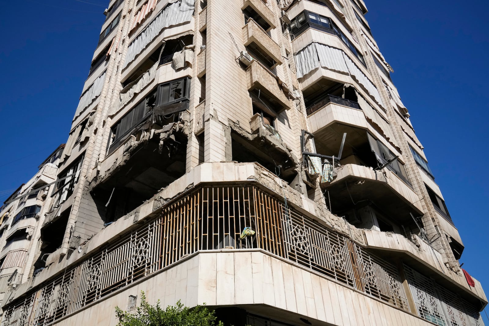 A destroyed apartment in a multistory building hit by Israeli airstrike, in central Beirut, Lebanon, Thursday, Oct. 3, 2024. (AP Photo/Hussein Malla)