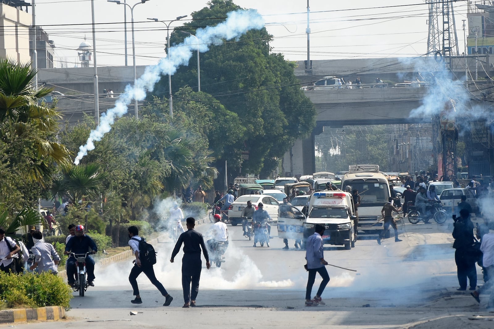 Police fire tear gas to disperse students protesting over an alleged on-campus rape in Punjab, in Rawalpindi, Pakistan, Thursday, Oct. 17, 2024. (AP Photo/W.K. Yousafzai)