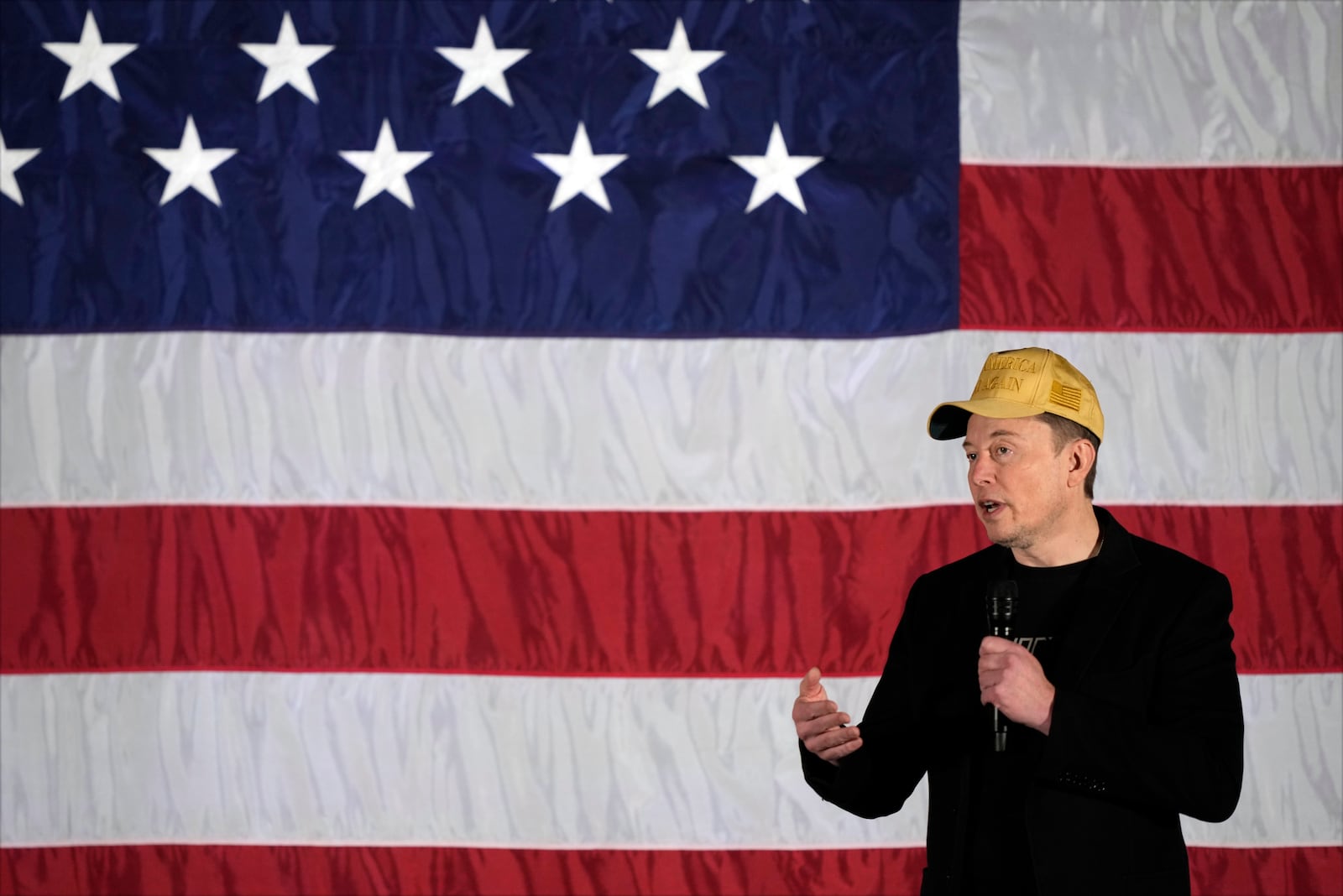 Elon Musk speaks as part of a campaign town hall in support of Republican presidential nominee former President Donald Trump in Folsom, Pa., Thursday, Oct. 17, 2024. (AP Photo/Matt Rourke)