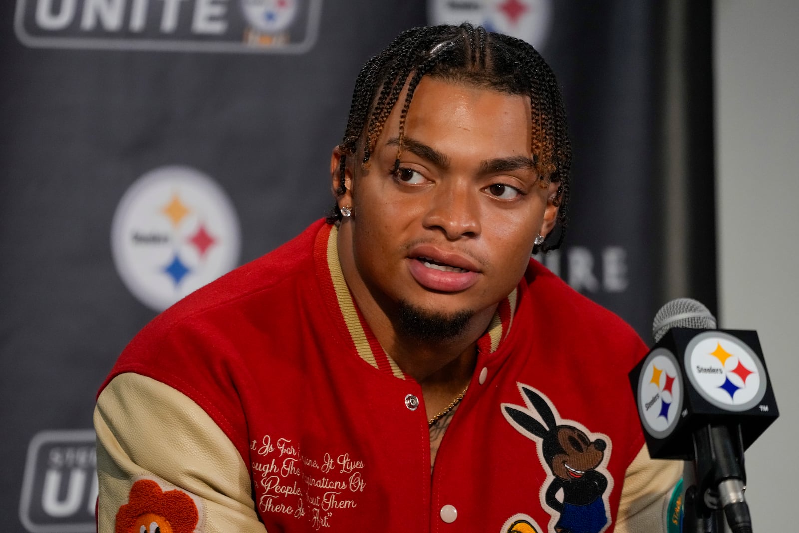 Pittsburgh Steelers quarterback Justin Fields talks to reporters following an NFL football game against the Dallas Cowboys, early Monday, Oct. 7, 2024, in Pittsburgh. The Cowboys won 20-17. (AP Photo/Gene J. Puskar)