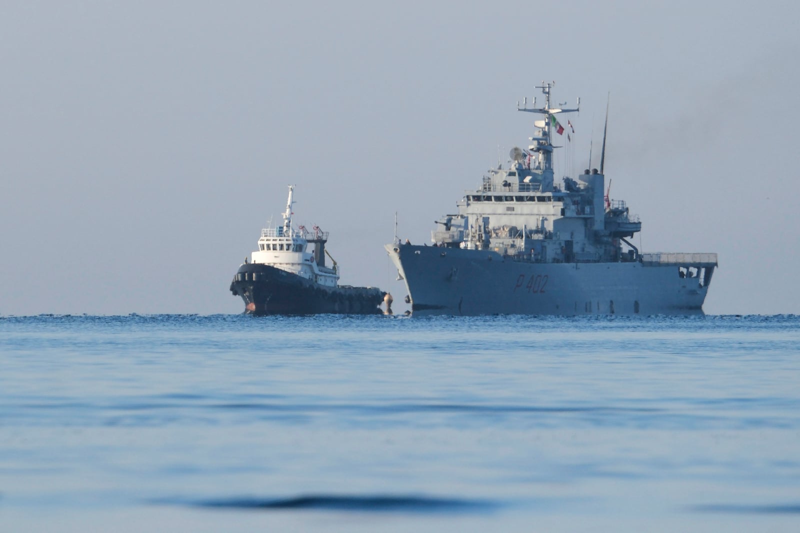 The Italian navy ship Libra approaches the port of Shengjin, northwestern Albania, Friday, Nov. 8, 2024, with the second group of eight migrants intercepted in international waters to be processed there in a reception facility despite the failure with the first group last month.(AP Photo/Vlasov Sulaj)