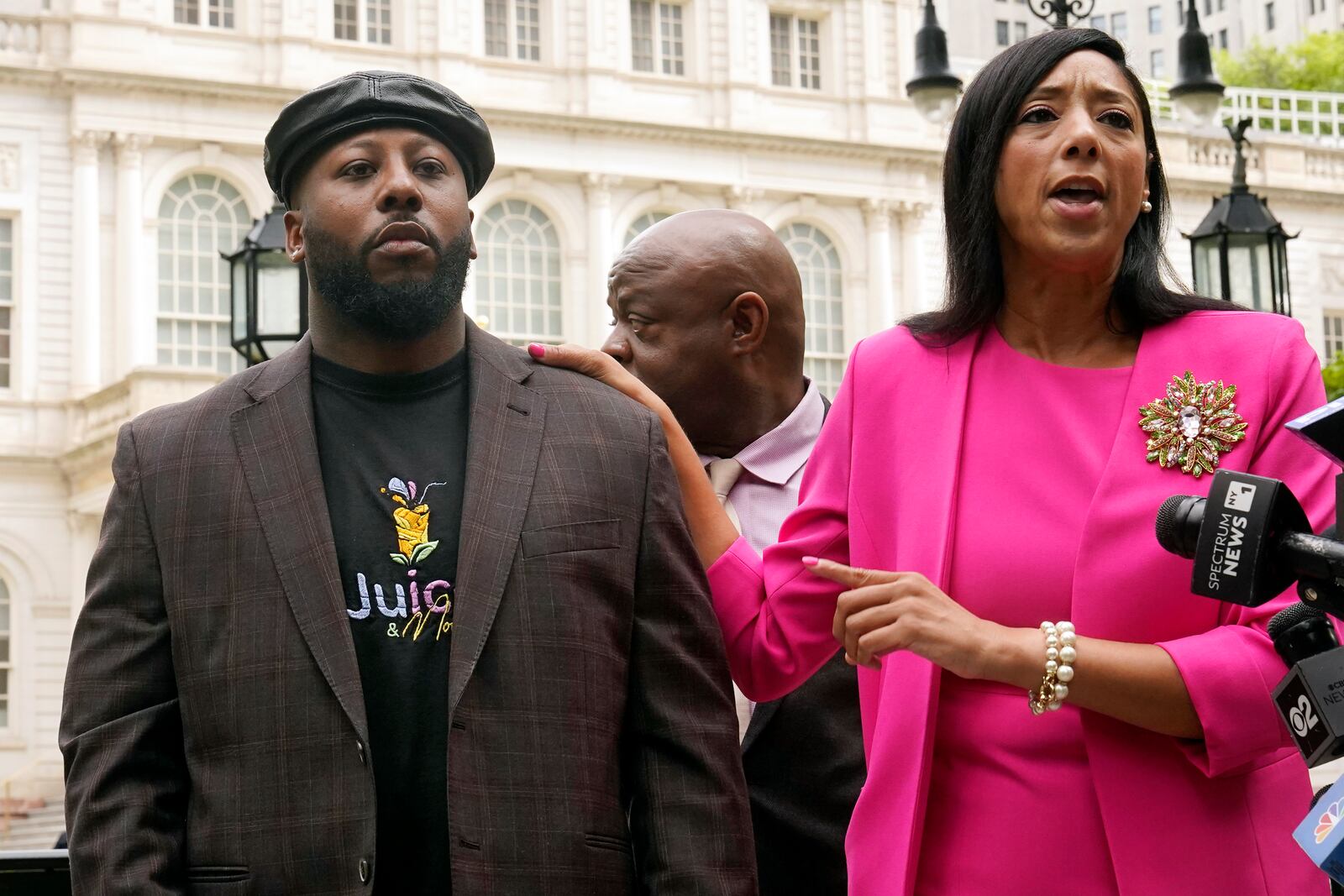 Shamel Kelly, left, is introduced by his attorney Bernarda Villalona, during a news conference in New York's City Hall Park, Tuesday, Oct. 1, 2024. (AP Photo/Richard Drew)