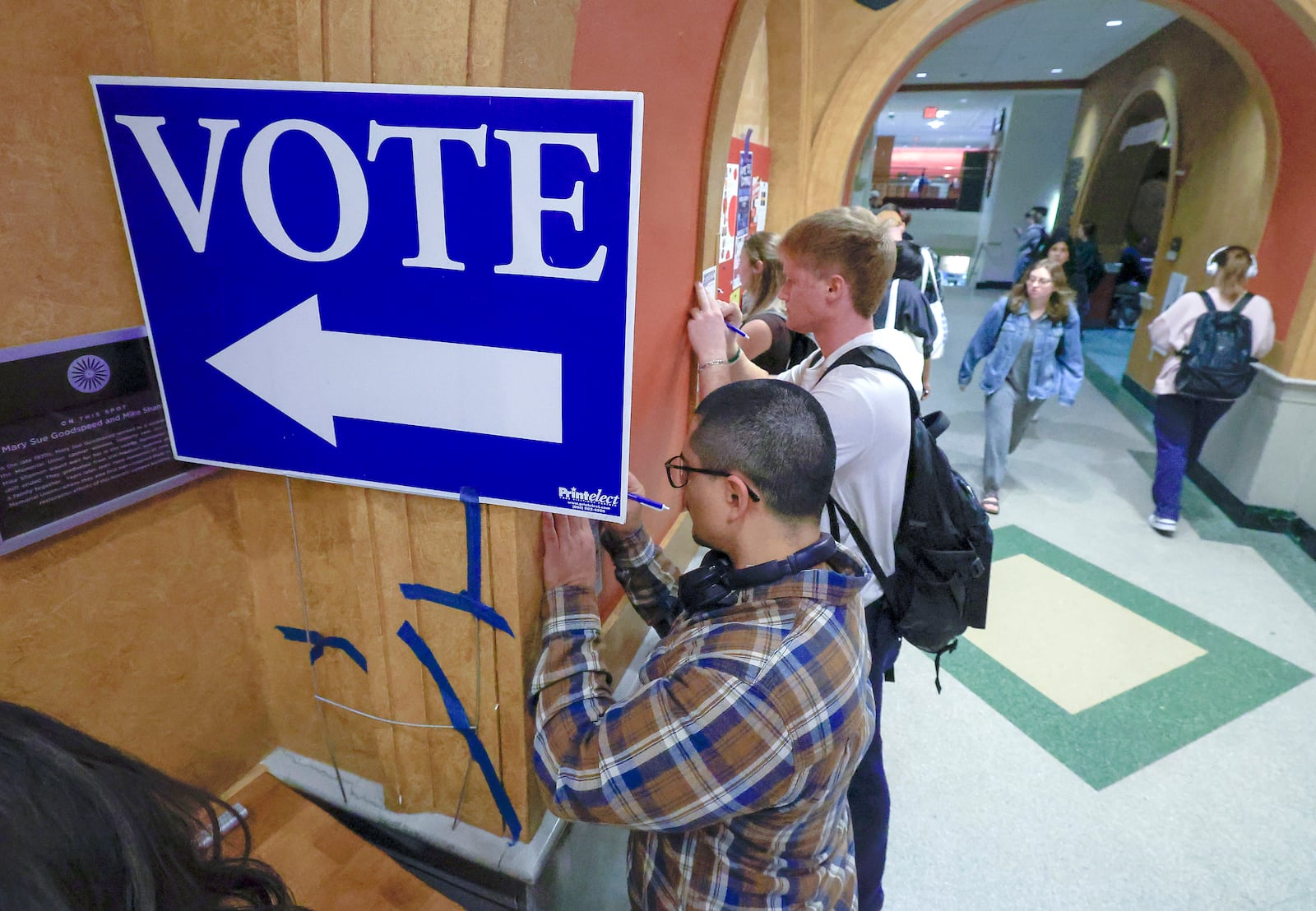 FILE - Students at The University of Wisconsin-Madison fill out ballots during the first day of Wisconsin's in-person absentee voting on the campus in Madison, Wisc., Tuesday, Oct. 22, 2024. (AP Photo/John Hart, Wisconsin State Journal, File)