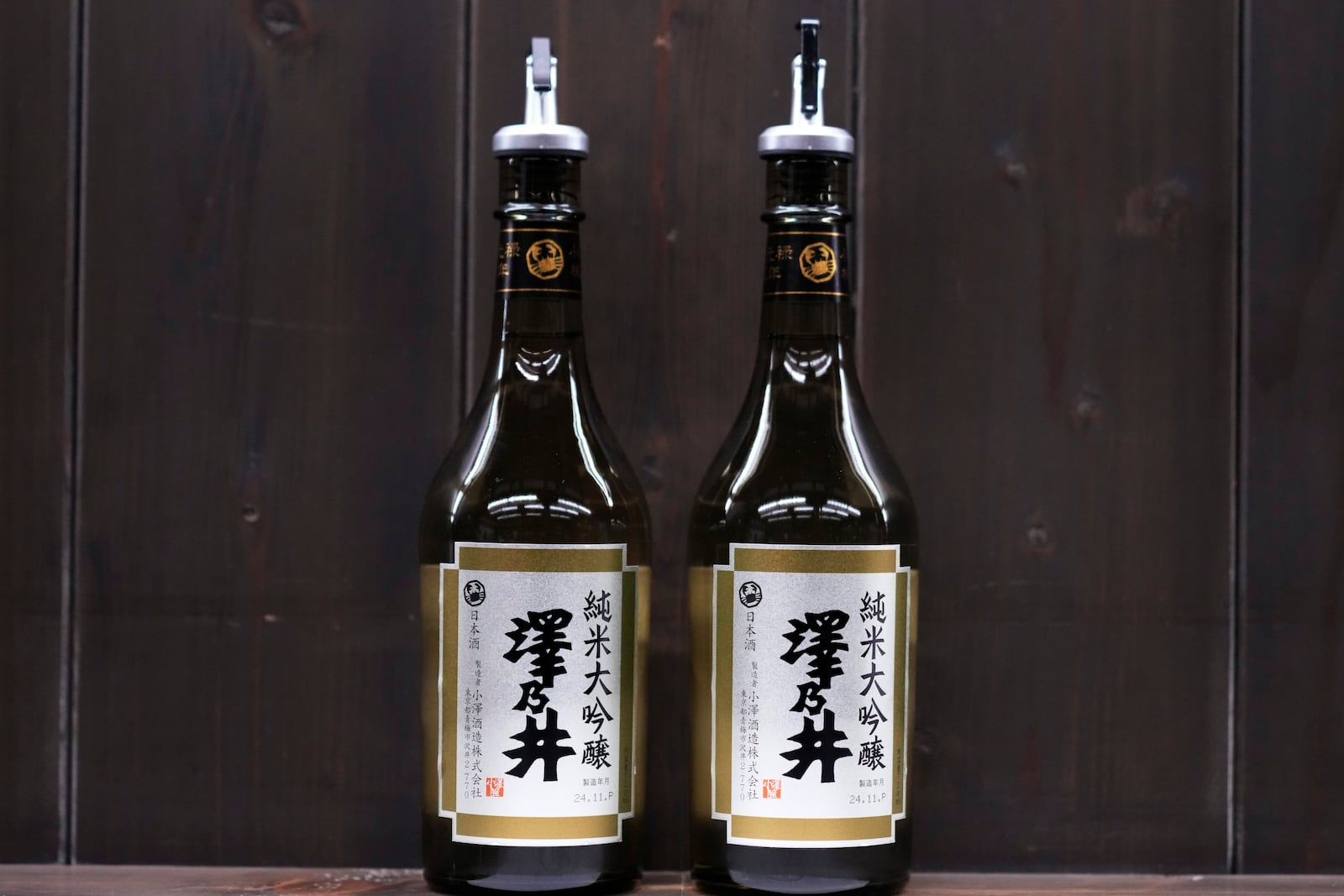 Bottles of Sawanoi, a Japanese sake brand by Ozawa Sake Brewery, are prepared for tasting at a room during a media tour at the brewery in Ome, on the western outskirts of Tokyo, Japan, Wednesday, Nov. 13, 2024. (AP Photo/Hiro Komae)