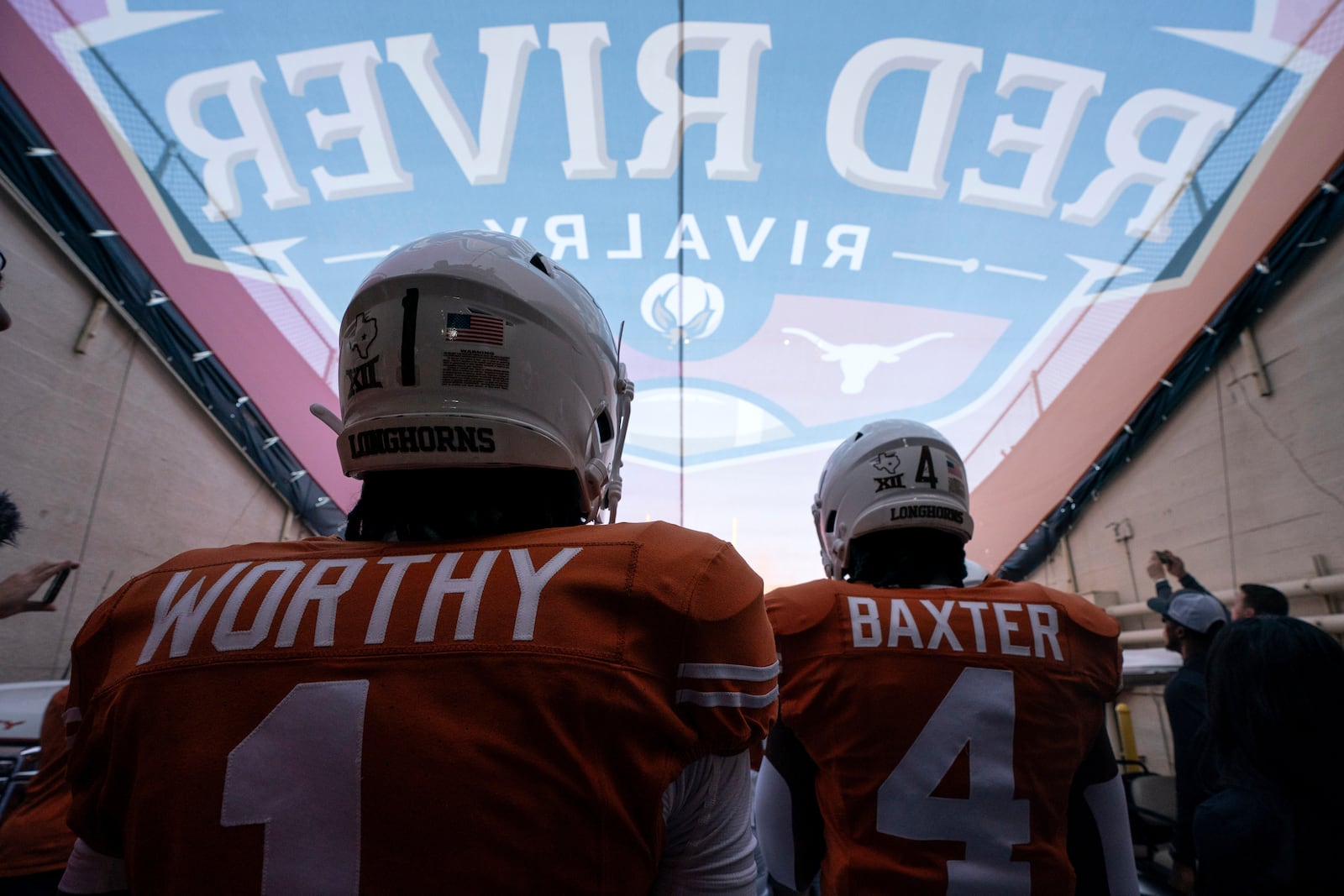 FILE - Texas wide receiver Xavier Worthy (1) and running back CJ Baxter (4) wait in the tunnel before an NCAA college football game against Oklahoma at the Cotton Bowl, Saturday, Oct. 7, 2023, in Dallas. (AP Photo/Jeffrey McWhorter, File)