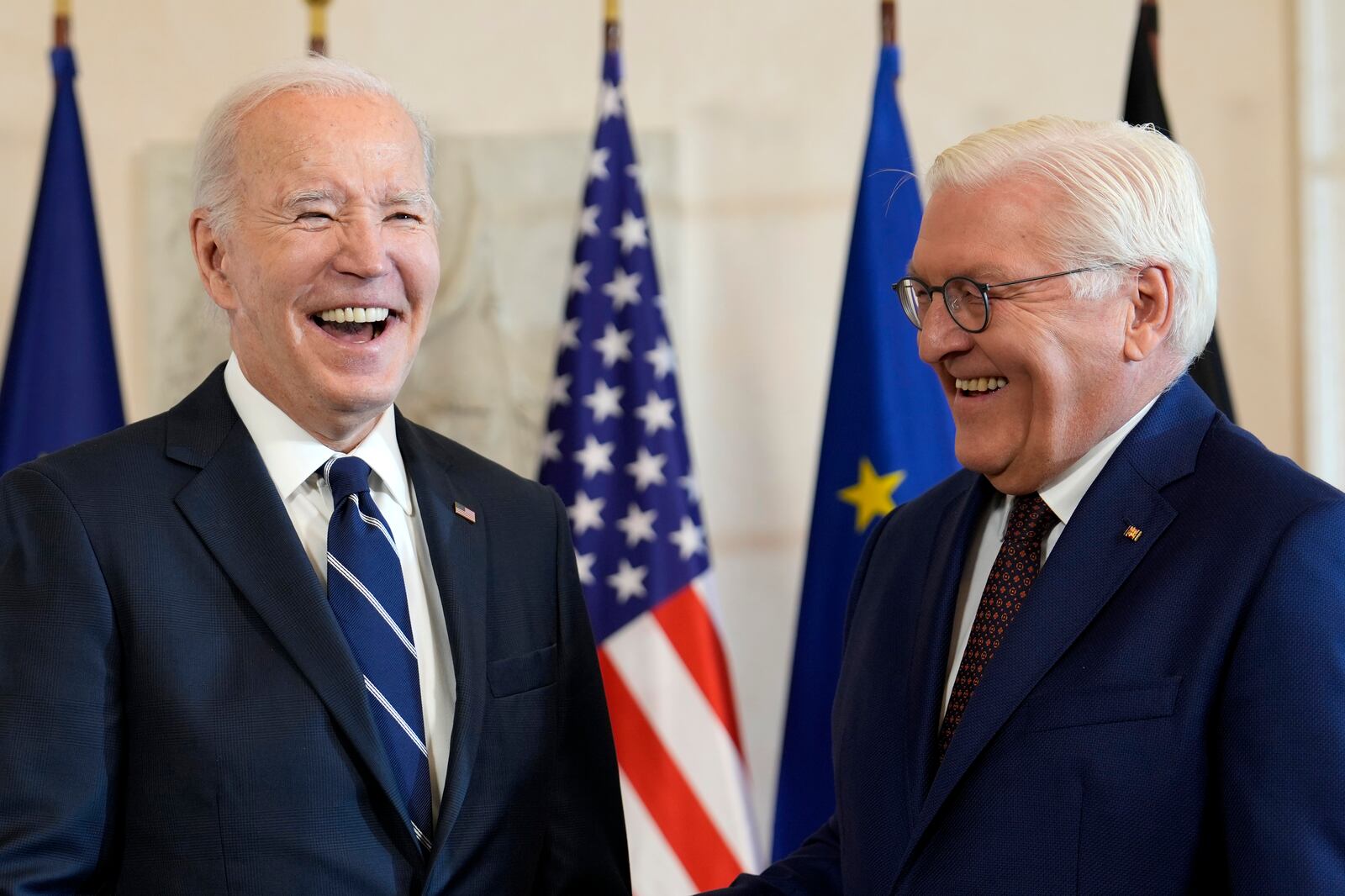 President Joe Biden, left, is greeted by German President Frank-Walter Steinmeier during the welcoming ceremony at Bellevue Palace in Berlin, Germany, Friday, Oct. 18, 2024. (AP Photo/Ben Curtis)