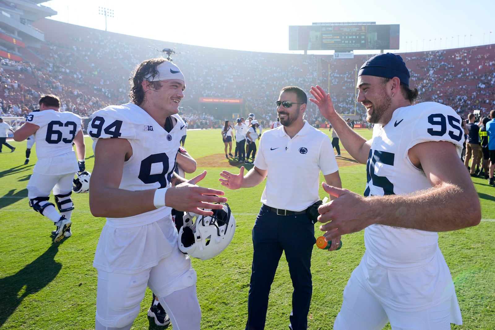 Penn State place kicker Ryan Barker, left, celebrates with defensive end Jordan Mayer (95) after Barker's game-winning field goal in overtime during an NCAA college football game against Southern California, Saturday, Oct. 12, 2024, in Los Angeles. (AP Photo/Marcio Jose Sanchez)