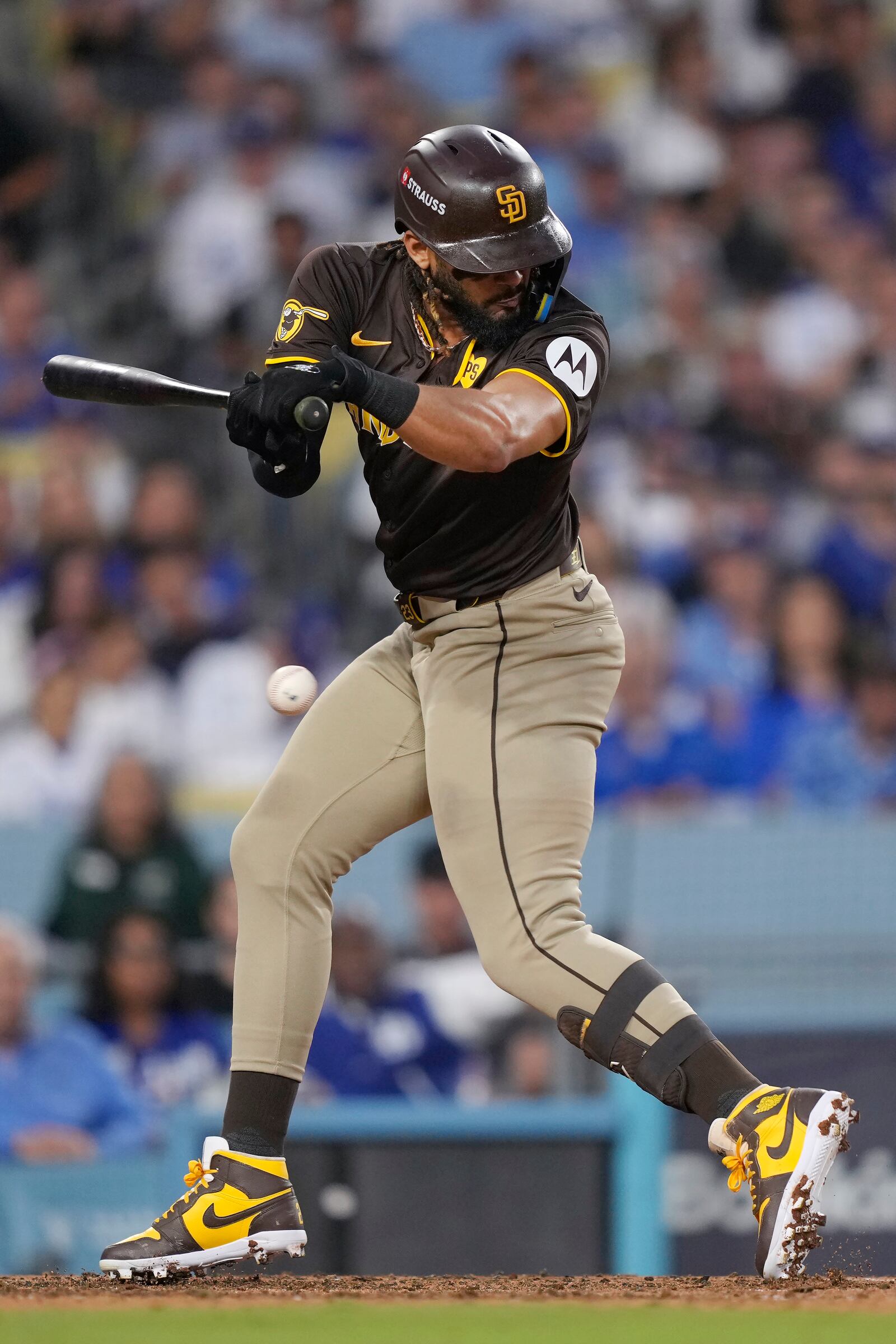 San Diego Padres' Fernando Tatis Jr. is hit by a pitch during the sixth inning in Game 2 of a baseball NL Division Series against the Los Angeles Dodgers, Sunday, Oct. 6, 2024, in Los Angeles. (AP Photo/Mark J. Terrill)