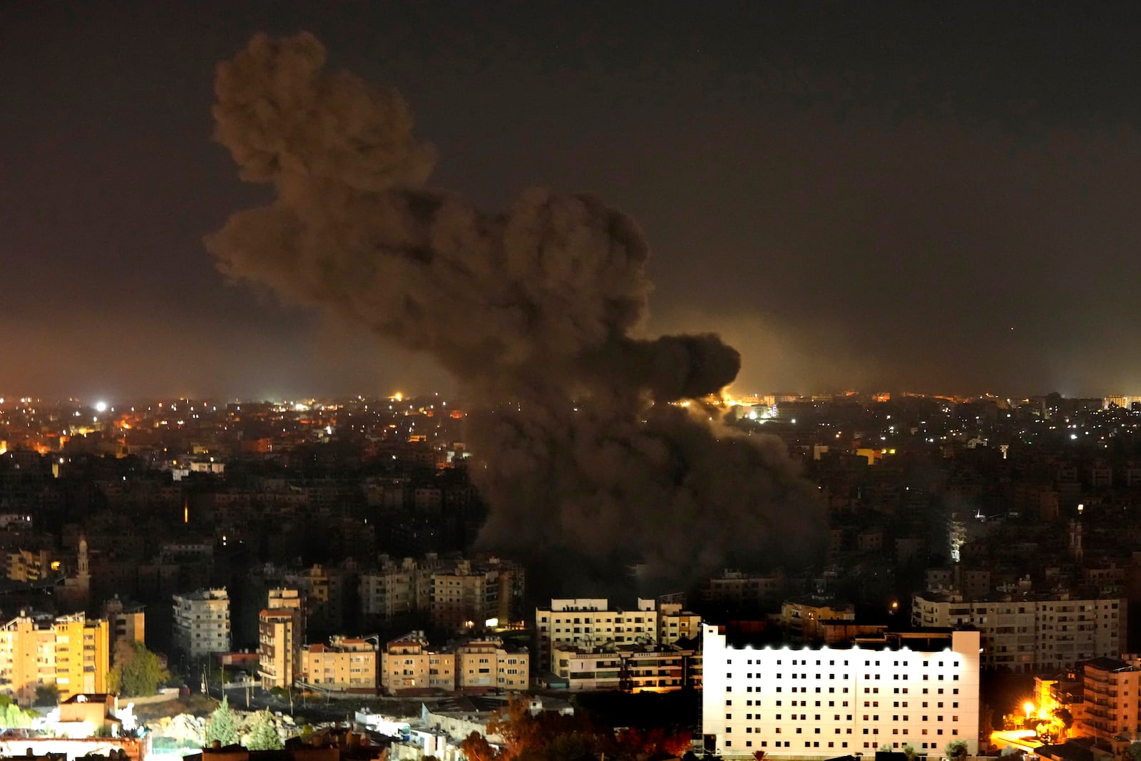 Smoke rises from an Israeli airstrike in Dahiyeh, Beirut, Lebanon, Tuesday, Oct. 8, 2024. (AP Photo/Hassan Ammar)