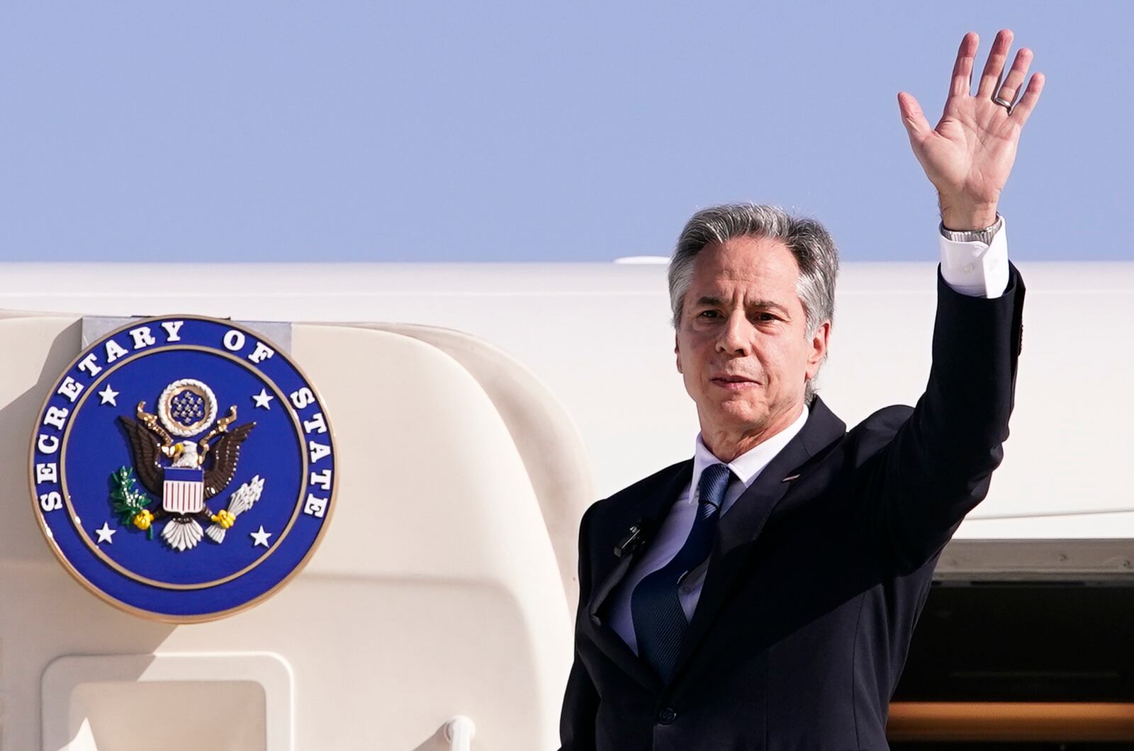 U.S. Secretary of State Antony Blinken waves as he departs for Riyadh, Saudi Arabia, from Ben Gurion International Airport in Tel Aviv, Israel, Wednesday, Oct. 23, 2024. (Nathan Howard/Pool Photo via AP)