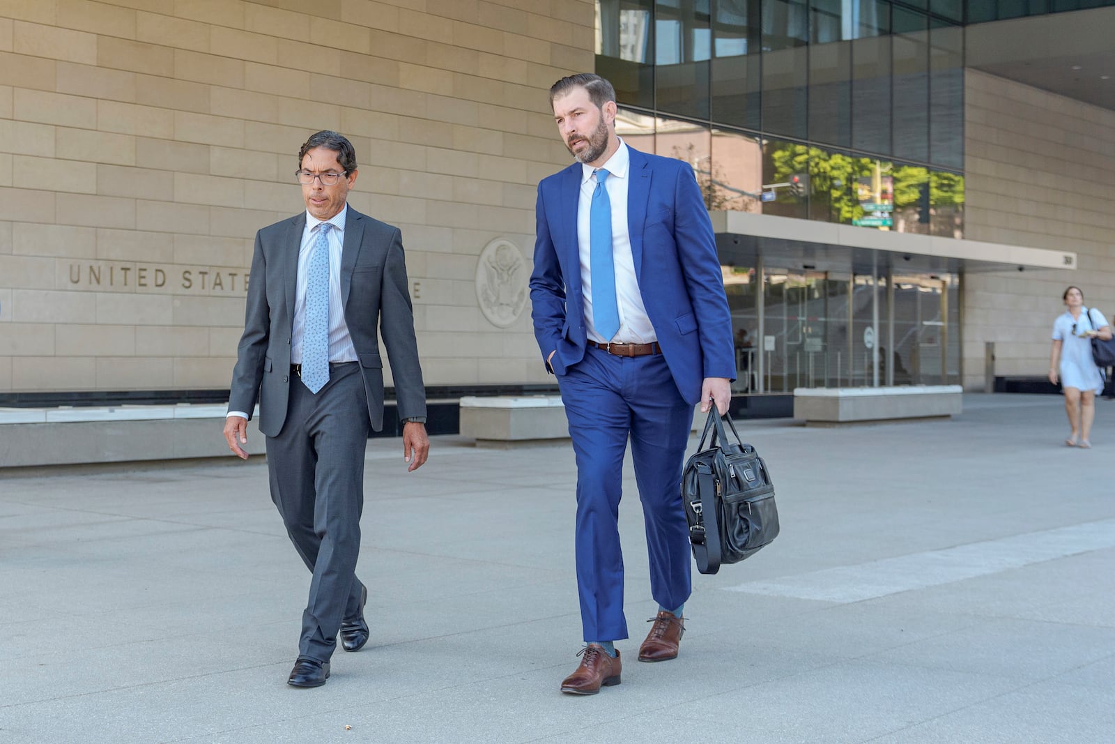 Dr. Mark Chavez, a physician from San Diego, who is charged in connection with Matthew Perry's fatal overdose, left, walks out of the United States Courthouse with his with his criminal defense attorney, Matthew Binninger, after pleading guilty to conspiring to distribute the surgical anesthetic ketamine in Los Angeles on Wednesday, Oct. 2, 2024. (AP Photo/Damian Dovarganes)