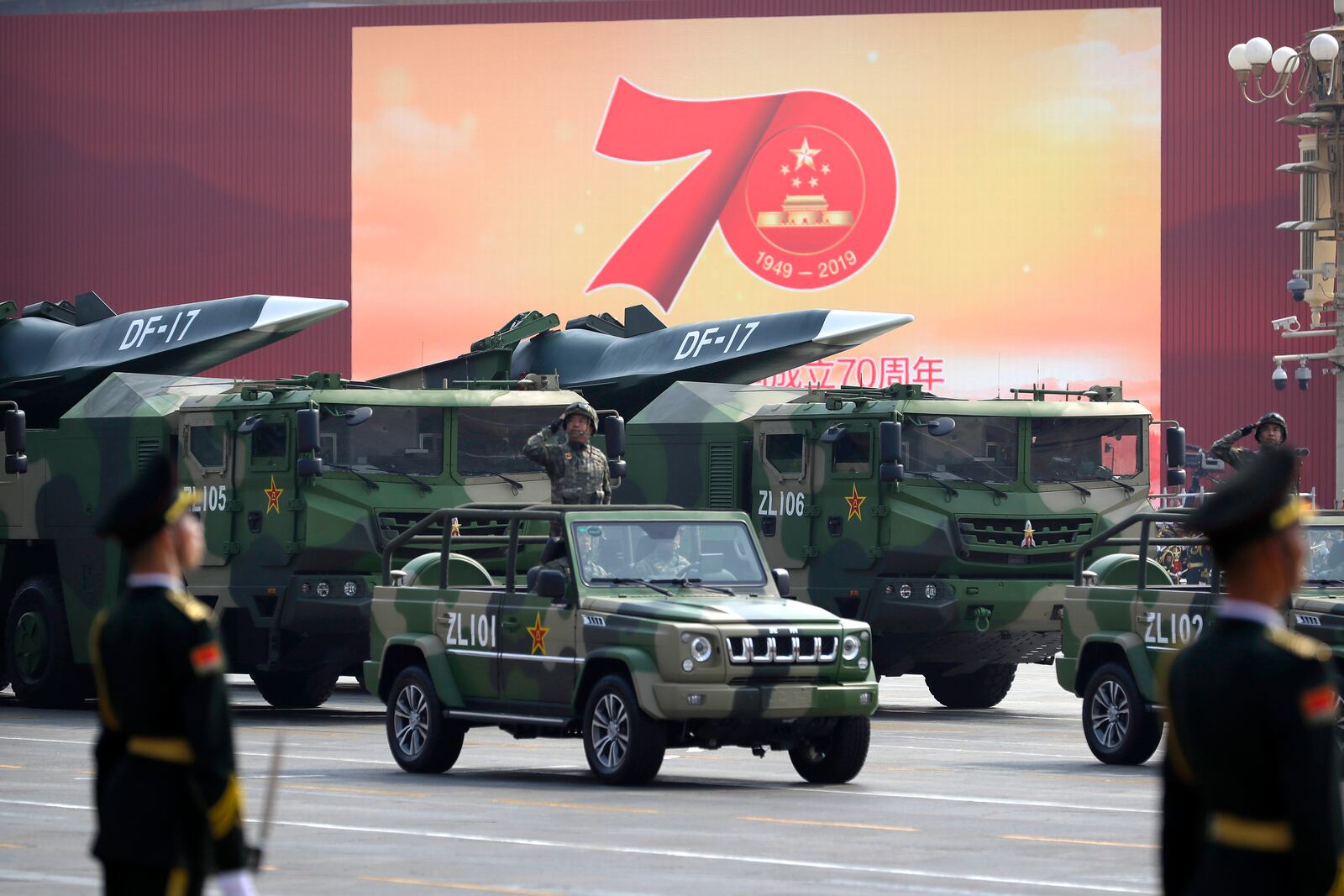 FILE - Chinese military vehicles carrying DF-17 ballistic missiles roll during a parade to commemorate the 70th anniversary of the founding of Communist China in Beijing, Tuesday, Oct. 1, 2019. (AP Photo/Mark Schiefelbein, File)