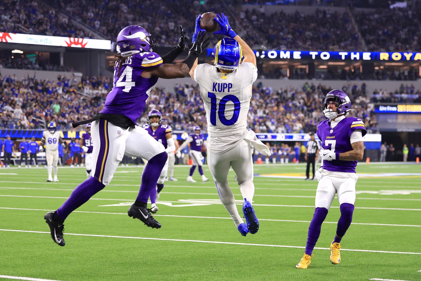 Los Angeles Rams wide receiver Cooper Kupp (10) tries to catch a pass as Minnesota Vikings safety Josh Metellus (44) defends during the second half of an NFL football game, Thursday, Oct. 24, 2024, in Inglewood, Calif. (AP Photo/Ryan Sun)