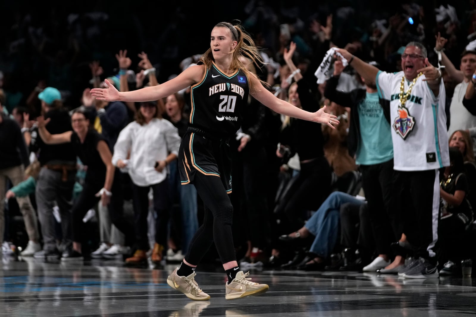 New York Liberty's Sabrina Ionescu (20) reacts after scoring during the first half in Game 1 of a WNBA basketball final playoff series against the Minnesota Lynx, Thursday, Oct. 10, 2024, in New York. (AP Photo/Pamela Smith)