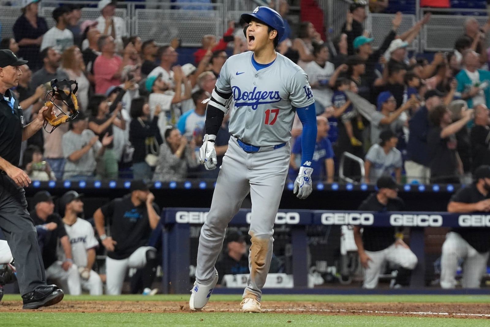 Los Angeles Dodgers' Shohei Ohtani (17) reacts after hitting his 50th home run of the season during the seventh inning of a baseball game against the Miami Marlins, Thursday, Sept. 19, 2024, in Miami. (AP Photo/Marta Lavandier)