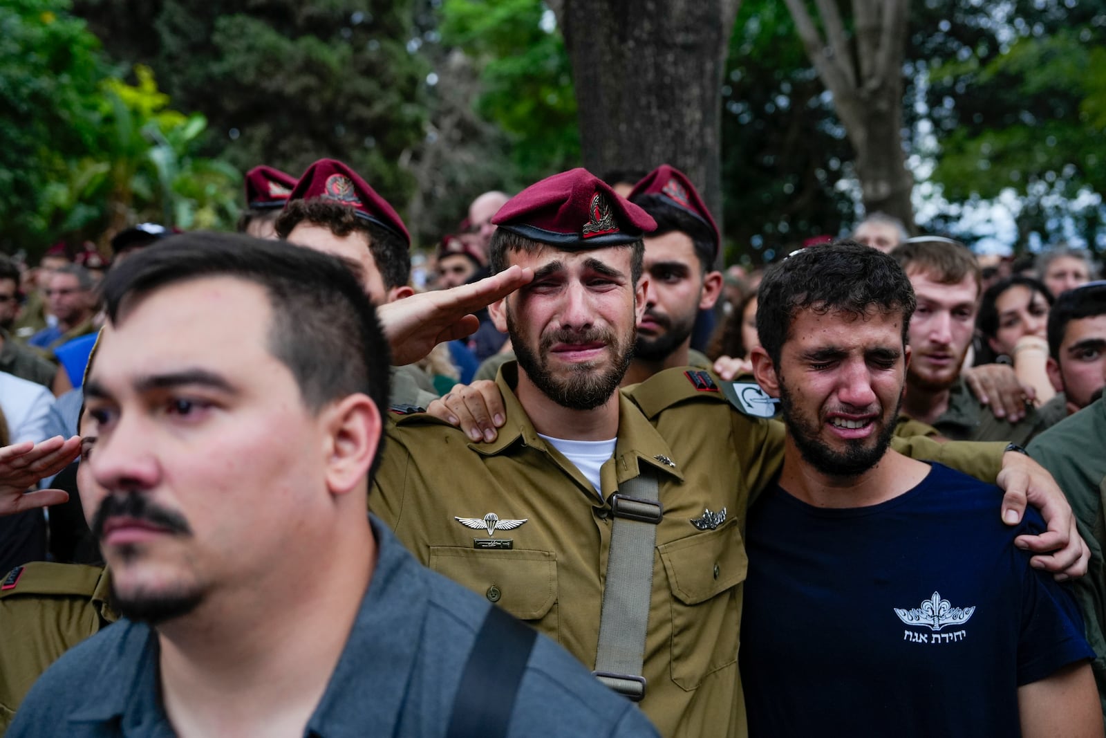 Mourners attend the funeral of Sgt. First Class Nazar Itkin who was killed during Israel's ground operation against Hezbollah militants in Lebanon, in Kiryat Ata, Israel, Sunday, Oct. 6, 2024. (AP Photo/Baz Ratner)