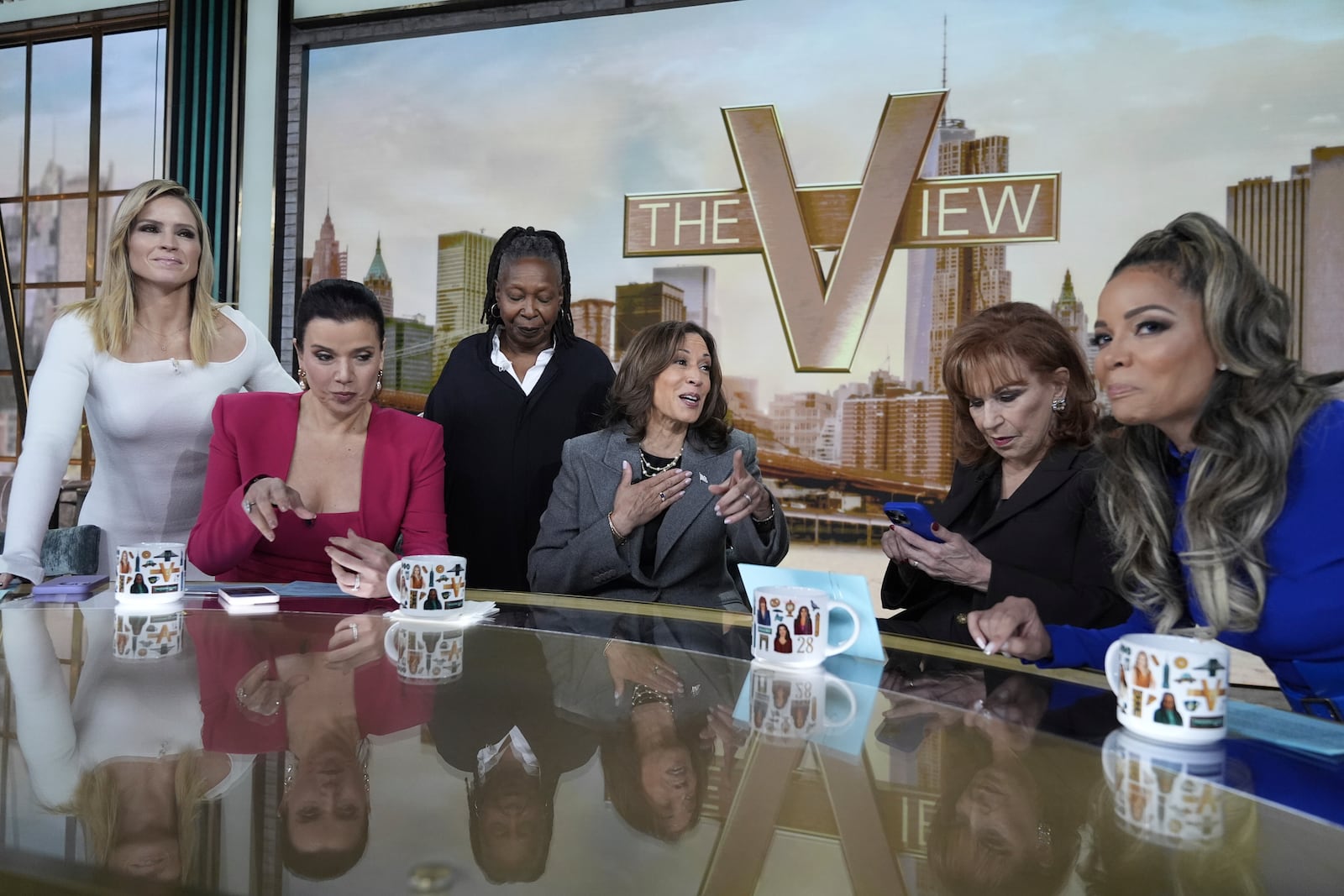 Democratic presidential nominee Vice President Kamala Harris chats with the hosts during a commercial break at The View, Tuesday, Oct. 8, 2024, in New York. (AP Photo/Jacquelyn Martin)