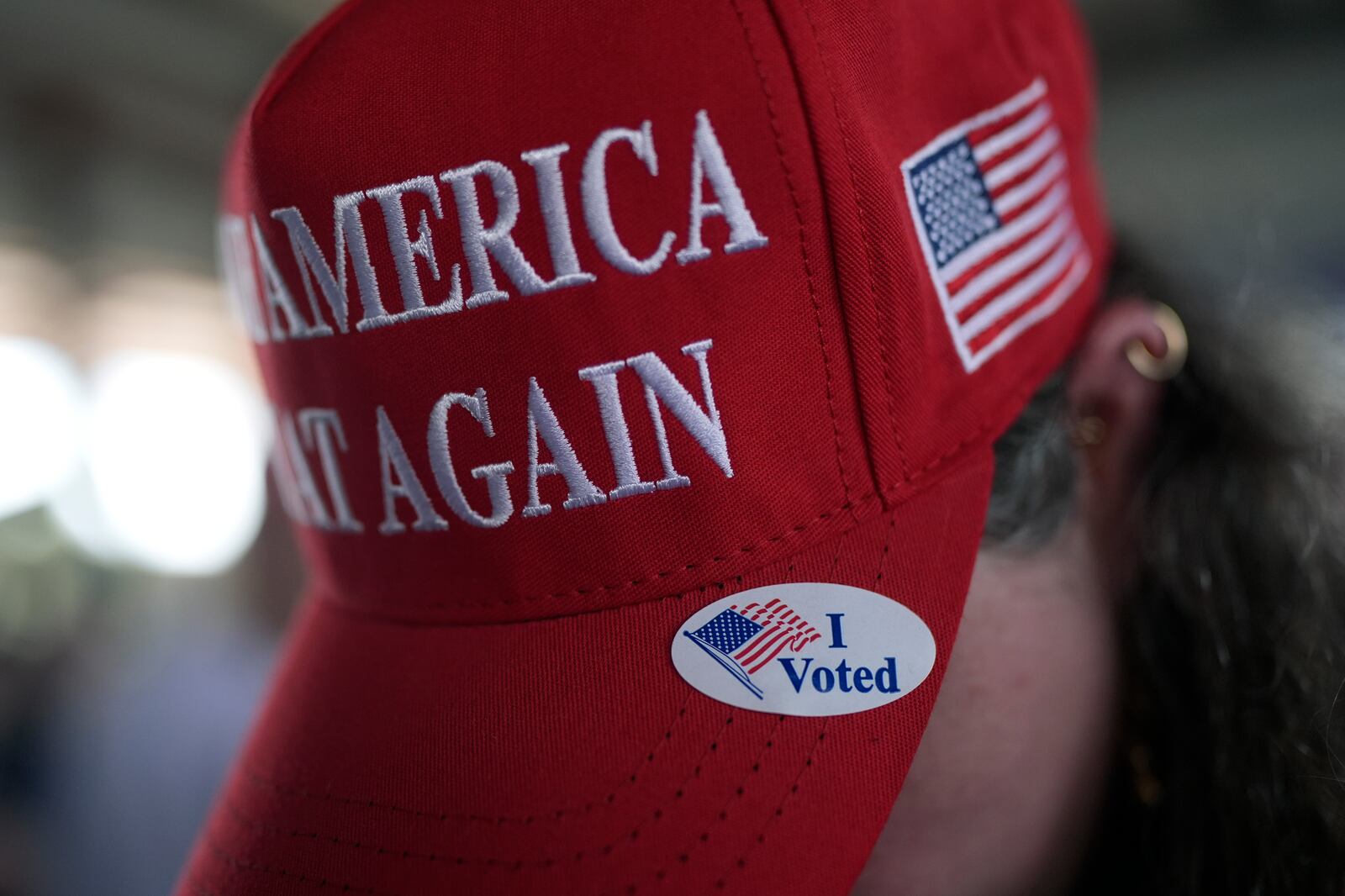 A supporter of Sen. Ted Cruz wears an "I Voted" sticker on her hat during a campaign rally Tuesday, Oct. 29, 2024, in Jourdanton, Texas. (AP Photo/Eric Gay)