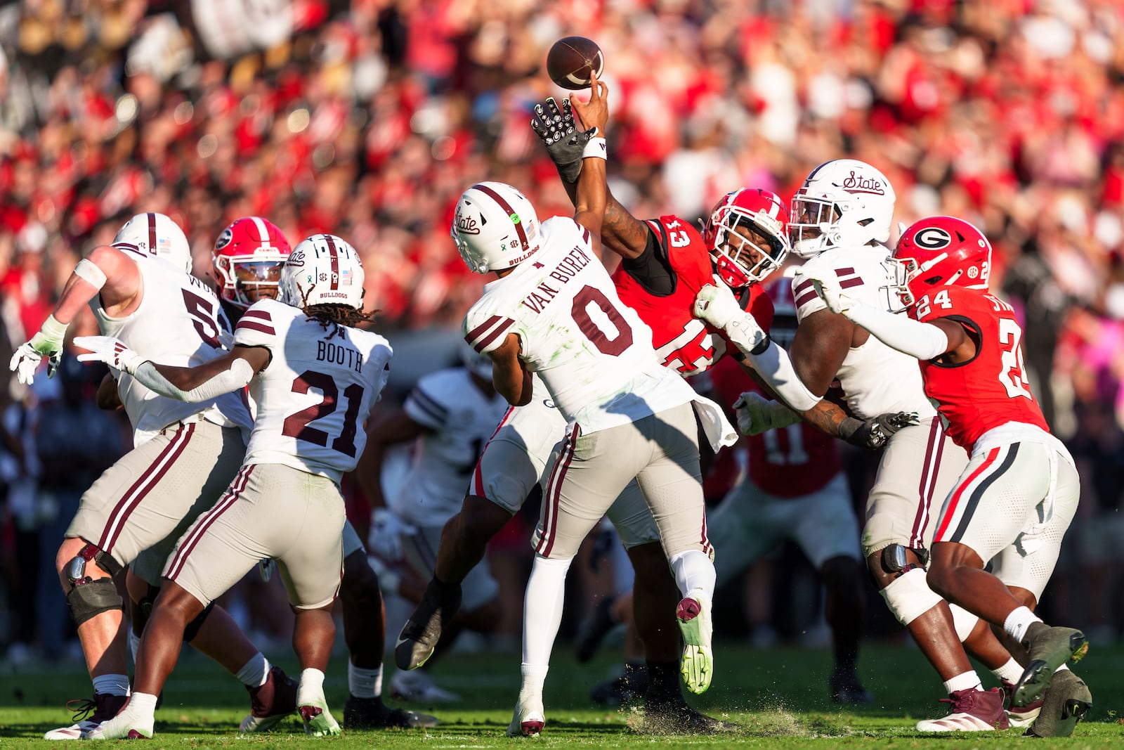 A pass by Mississippi State quarterback Michael Van Buren Jr. (0) is nearly blocked by Georgia defensive lineman Mykel Williams (13) during an NCAA college football game, Saturday, Oct. 12, 2024, in Athens, Ga. (AP Photo/Jason Allen)