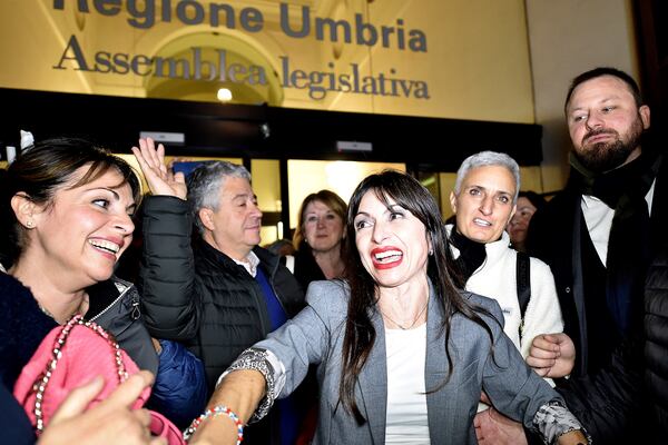 Center-left candidate Stefania Proietti, center, celebrates following regional elections in the region of Umbria, in Perugia, Italy, late Monday, Nov. 18, 2024. (Roberto Settonce/LaPresse via AP)