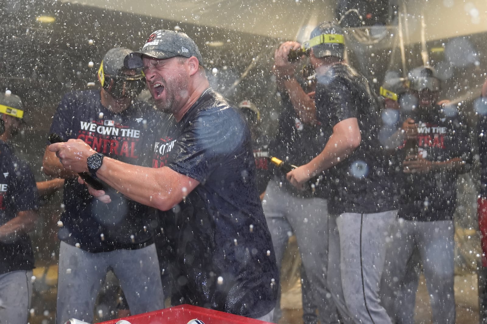 Cleveland Guardians manager Stephen Vogt celebrates with his team in the clubhouse following a baseball game against the St. Louis Cardinals and winning the American League Central Saturday, Sept. 21, 2024, in St. Louis. (AP Photo/Jeff Roberson)