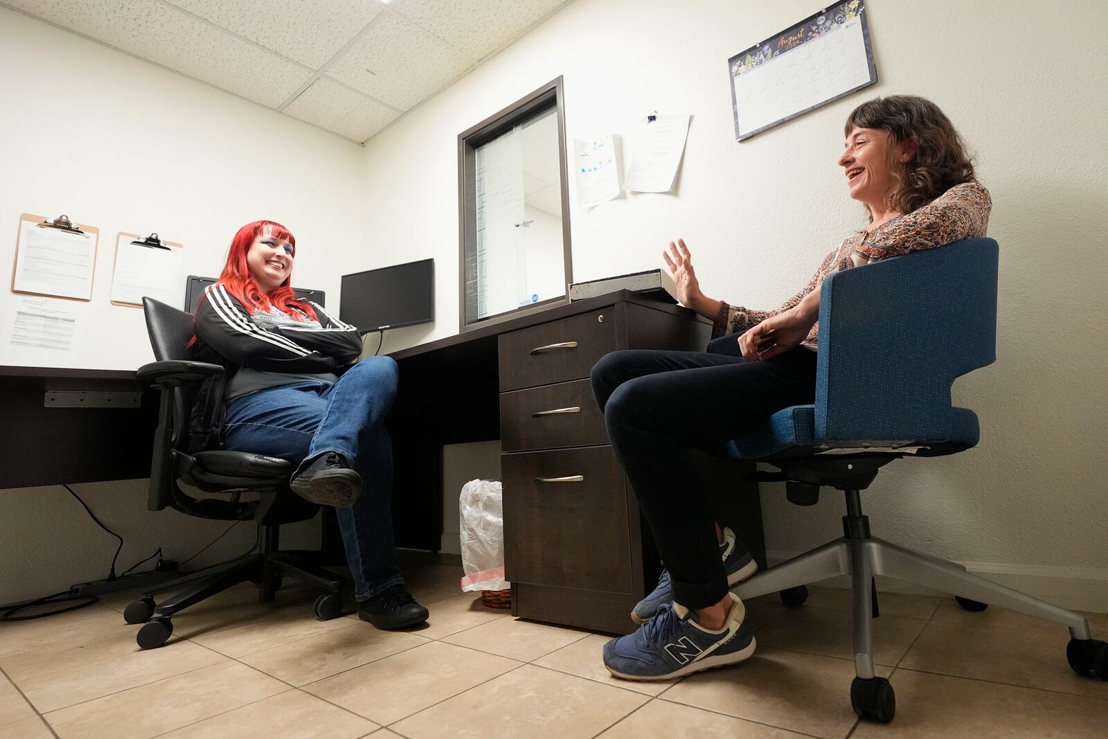 Methadone patient Irene Garnett, right, 44, of Phoenix, meets with counselor Melodie Reece at a clinic in Scottsdale, Ariz., on Monday, Aug. 26, 2024. (AP Photo/Ross D. Franklin)