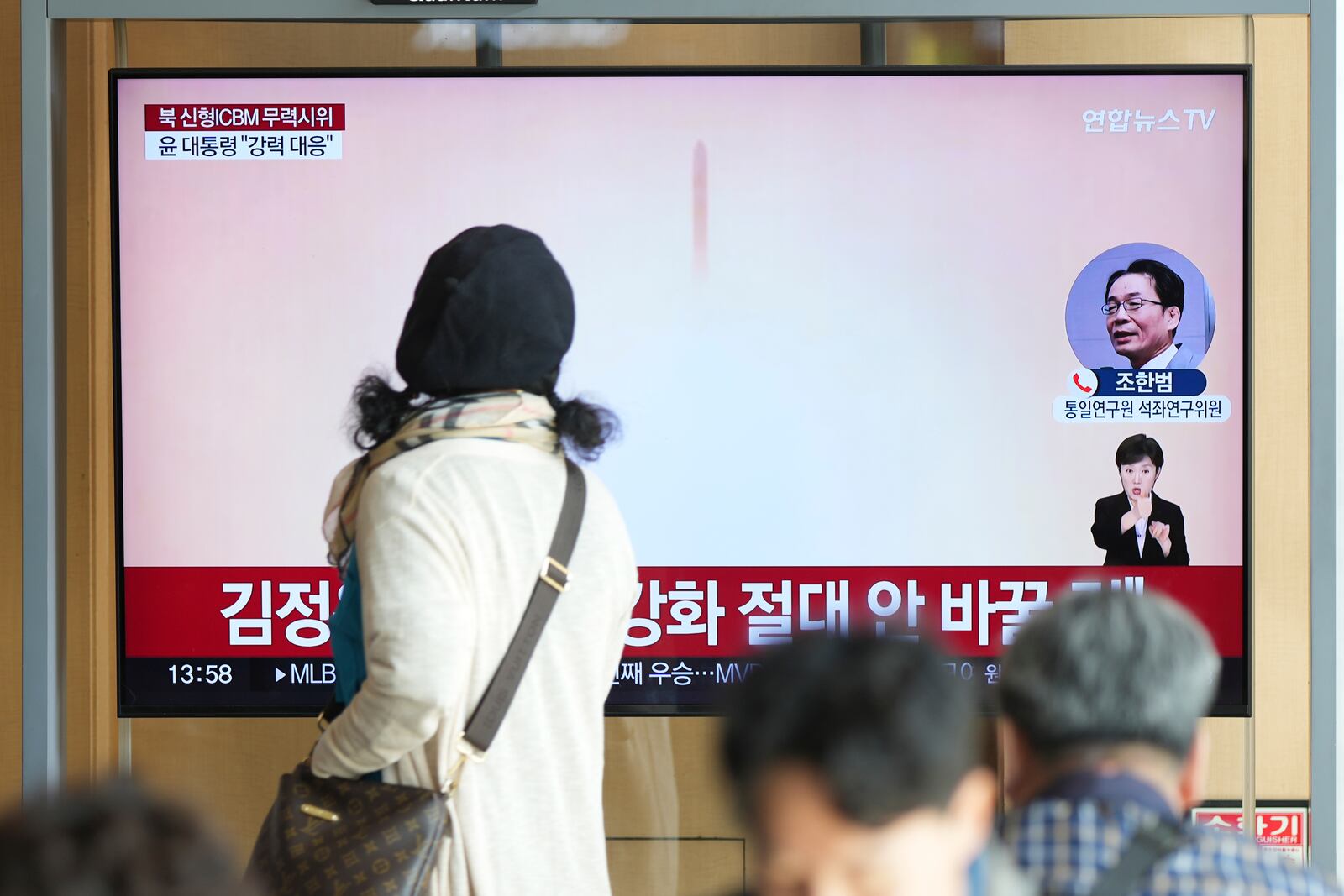 A TV screen reports North Korea's an intercontinental ballistic missile launch during a news program at the Seoul Railway Station in Seoul, South Korea, Thursday, Oct. 31, 2024. (AP Photo/Lee Jin-man)