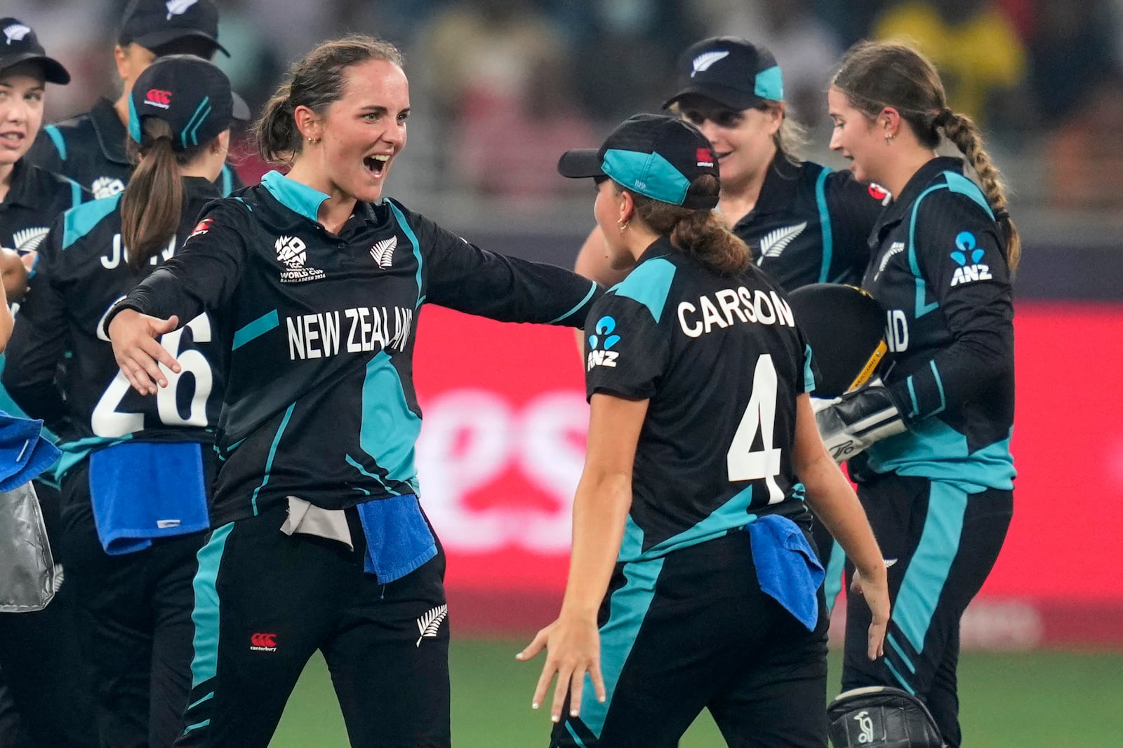 New Zealand's Amelia Kerr, center, celebrates with teammates the wicket of South Africa's captain Laura Wolvaardt during the ICC Women's T20 World Cup 2024 final match between New Zealand and South Africa at Dubai, United Arab Emirates, Sunday, Oct. 20, 2024. (AP Photo/Altaf Qadri)