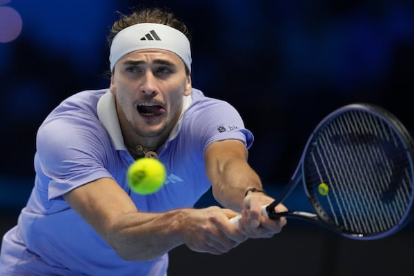 Germany's Alexander Zverev returns to Taylor Fritz of the United States during their semifinal tennis match of the ATP World Tour Finals at the Inalpi Arena in Turin, Italy, Saturday, Nov. 16, 2024. (AP Photo/Antonio Calanni)