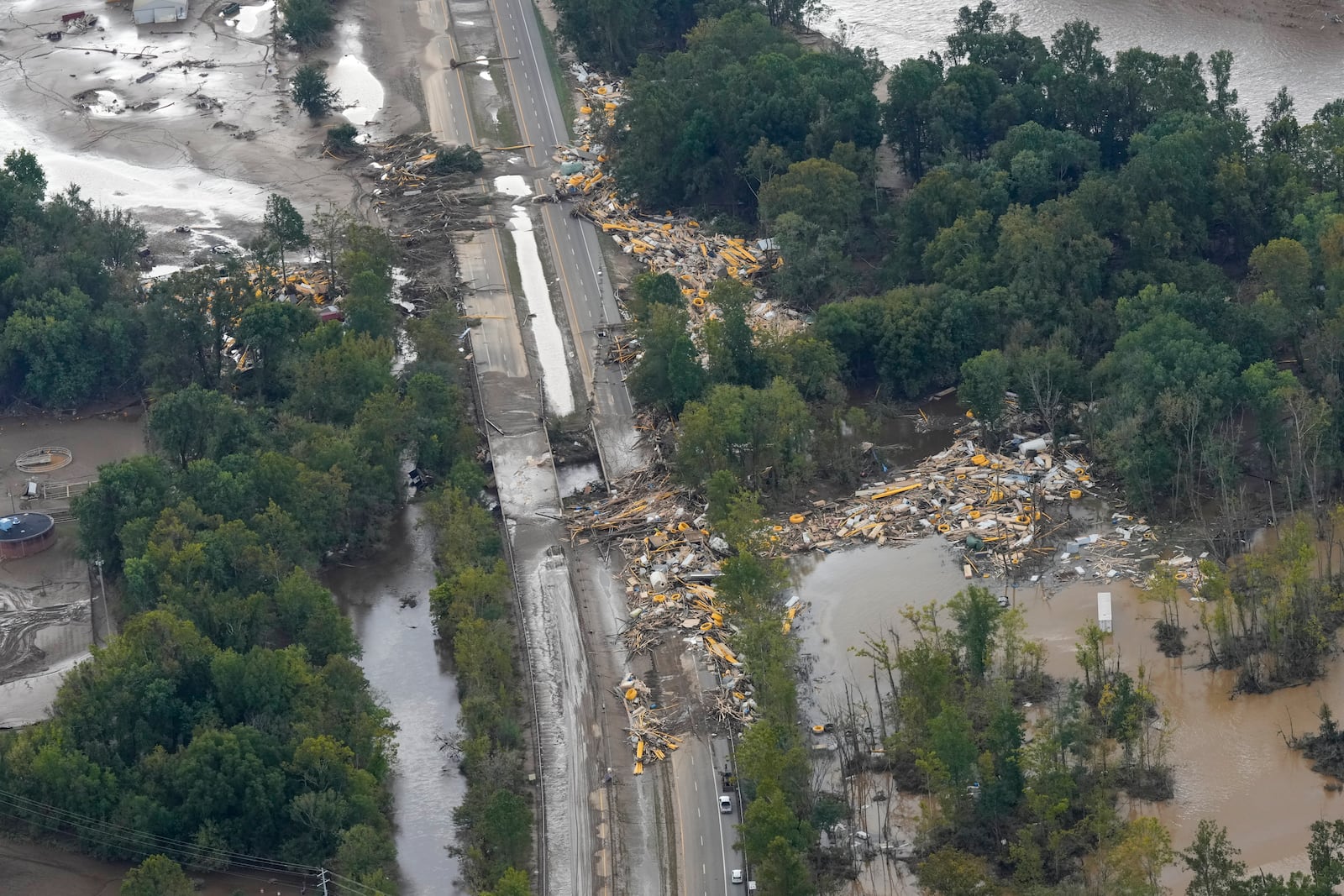 An aerial view of flood damage in the aftermath of Hurricane Helene, Saturday, Sept. 28, 2024, in Erwin, Tenn. (AP Photo/George Walker IV)