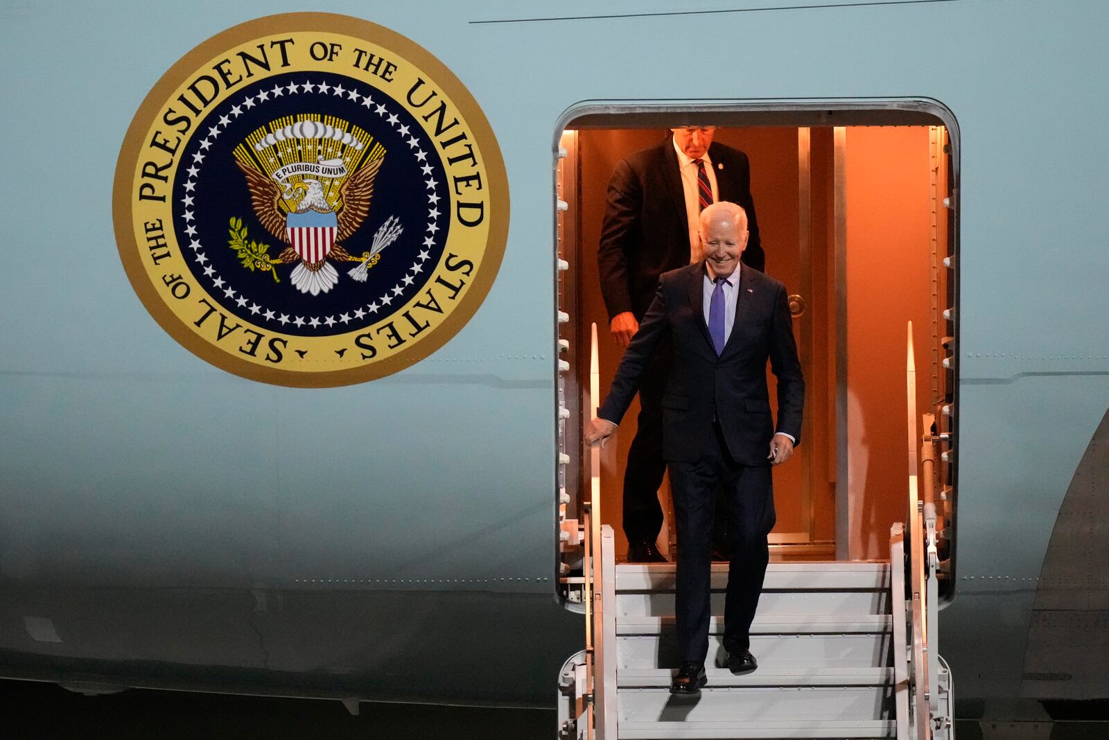 President Joe Biden walks down the stairs of Air Force One as he arrives at Brandenburg Airport in Schoenefeld near Berlin, Germany, Thursday, Oct. 17, 2024. (AP Photo/Matthias Schrader)