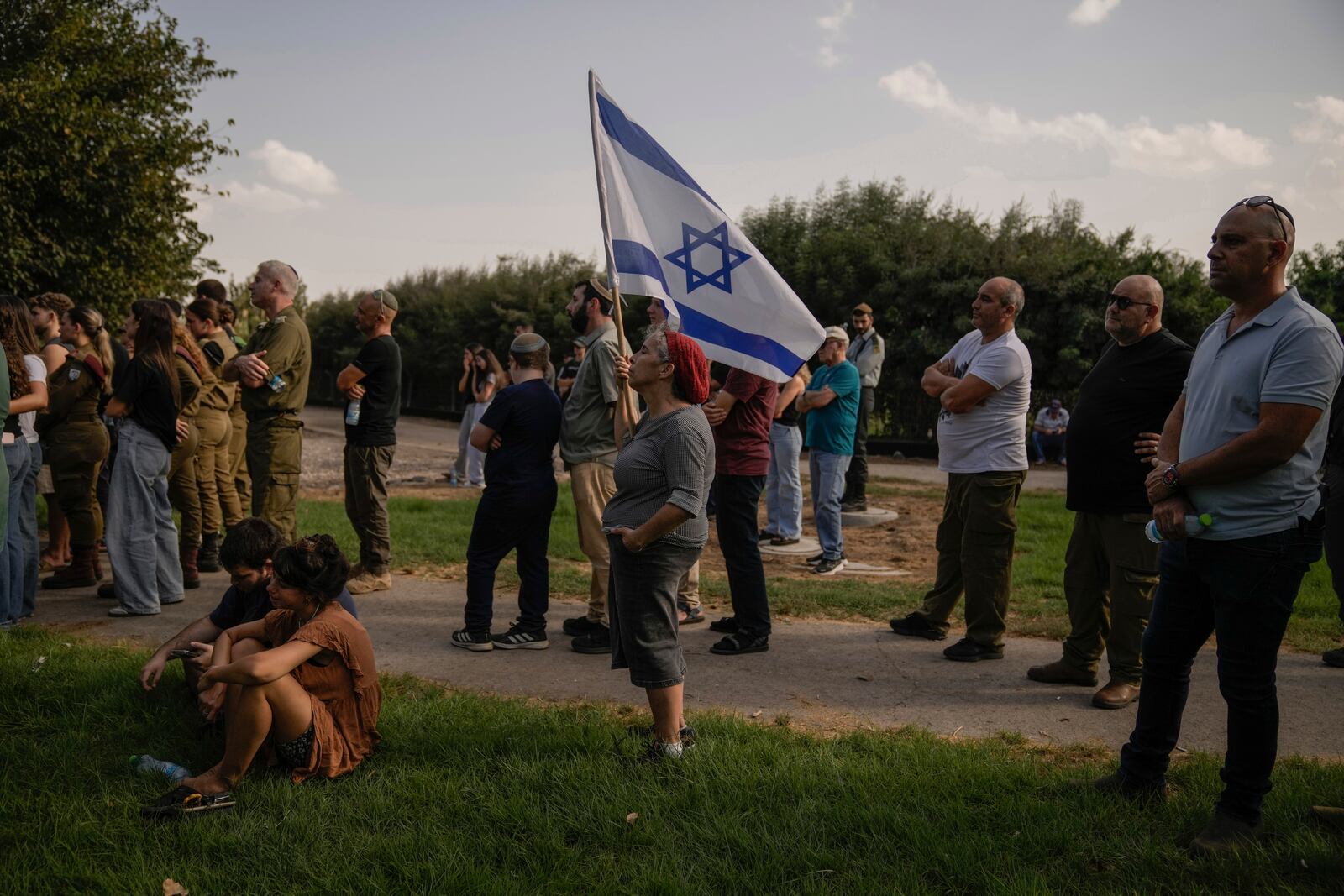 People mourn Israeli soldier Sgt. Amitai Alon, killed by a Hezbollah drone attack, during his funeral near Ramot Naftali, Israel, Monday, Oct. 14, 2024. (AP Photo/Leo Correa)