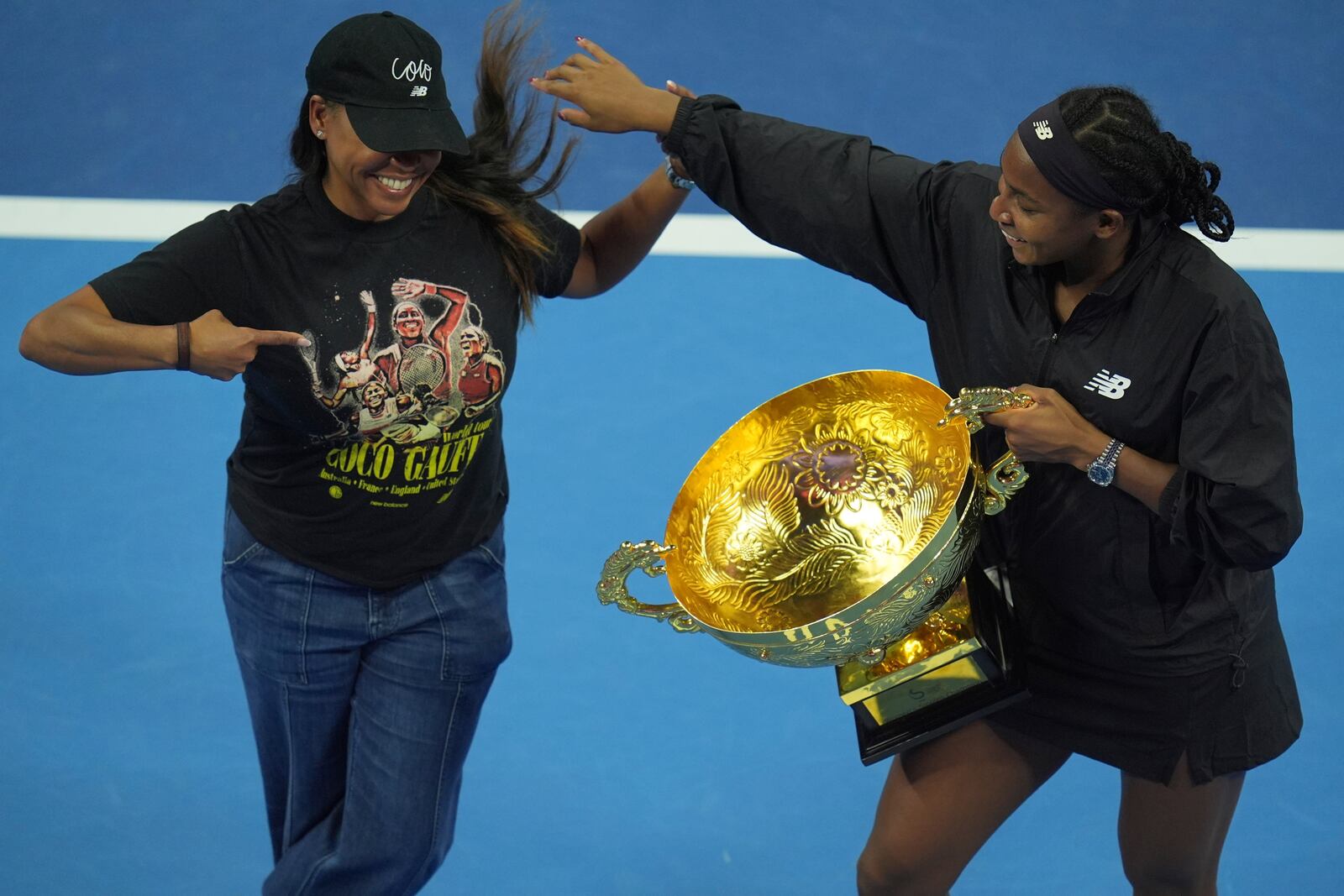 Coco Gauff of the United States, right, celebrates with her mother Candi Gauff after defeating Karolina Muchova of Czech Republic in the women's singles final match at the China Open tennis tournament at the National Tennis Center in Beijing, Sunday, Oct. 6, 2024. (AP Photo/Ng Han Guan)