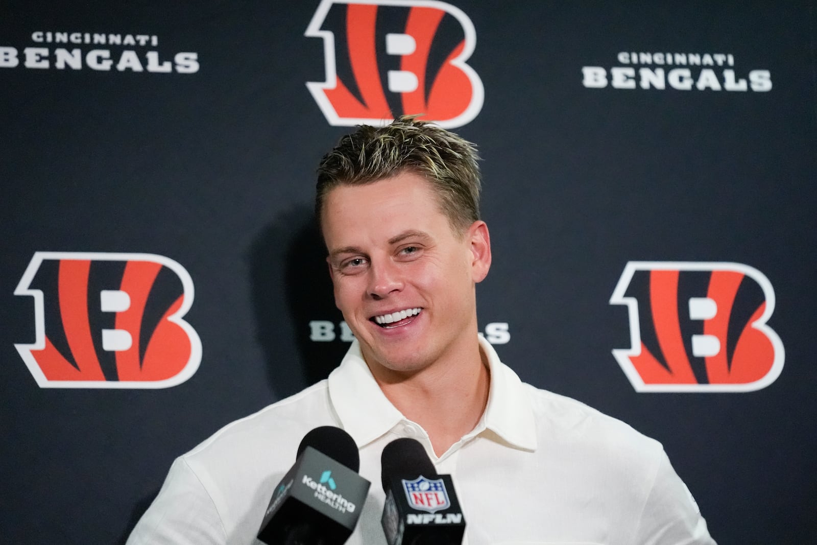 Cincinnati Bengals quarterback Joe Burrow smiles as he speaks during a news conference after an NFL football game against the New York Giants, Sunday, Oct. 13, 2024, in East Rutherford, N.J. The Bengals won 17-7. (AP Photo/Seth Wenig)